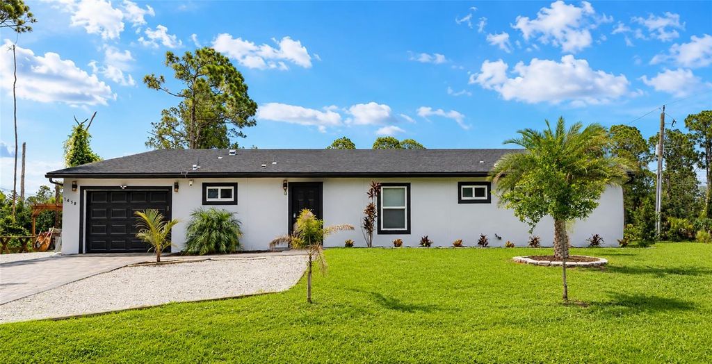 Photo of 1458 E Hallmark Boulevard, North Port, FL 34288 (MLS # A4699586)