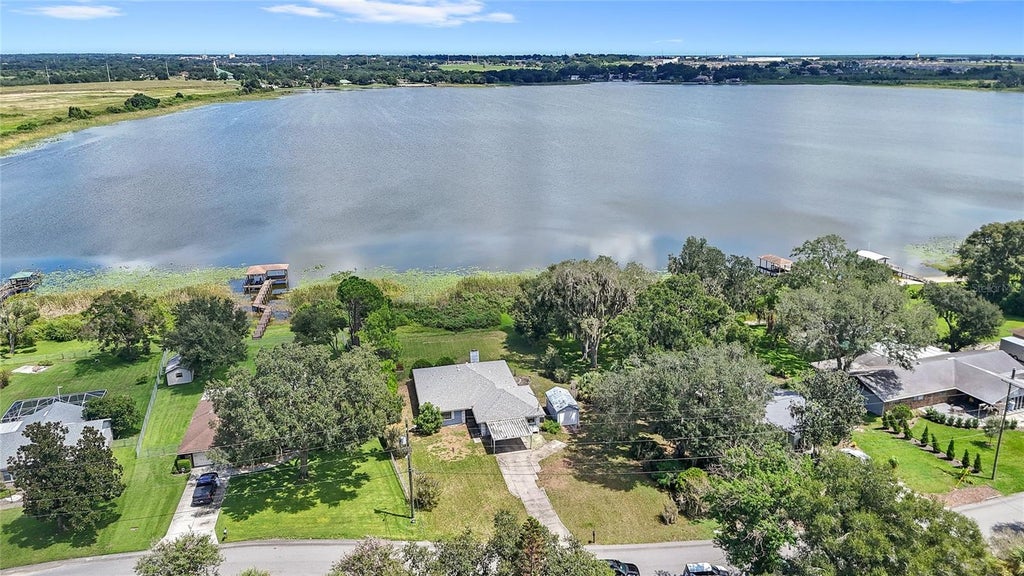 Photo of 310 Paradise Island Drive, Haines City, FL 33844 (MLS # O6438355)