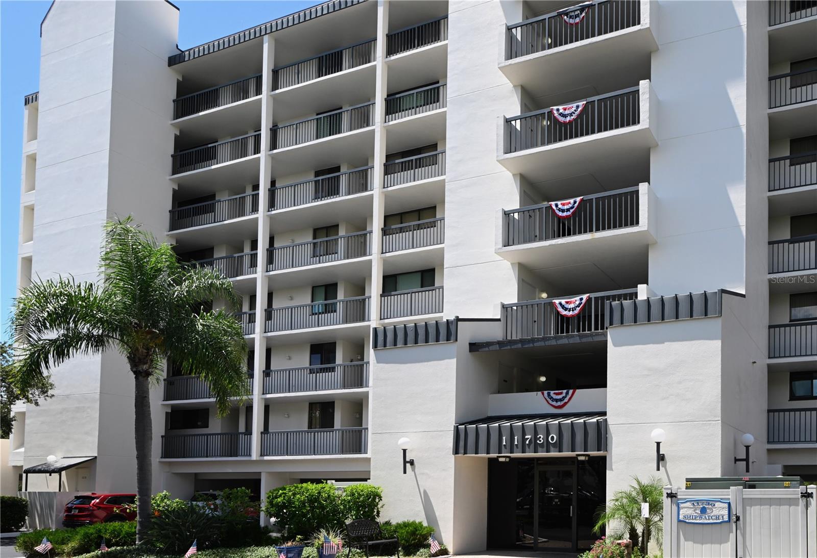 This beautifully updated 2 bedroom, 2 bath condo is nestled in the highly desirable Shipwatch Yacht & Tennis Club, a lush 56-acre gated waterfront community just over the bridge from Indian Rocks Beach and its award-winning Gulf shores. Located in sought-after Tower One, this residence offers a private lanai with western exposure, showcasing magnificent sunsets over the Intracoastal. Inside, you’ll find a light and bright kitchen with granite counters, upgraded cabinetry, stainless steel appliances, and extra storage, along with updated baths, plumbing, and appliances throughout. Gorgeous vinyl wood plank flooring flows through the living areas and both spacious bedrooms, each with a walk-in closet. The primary suite features an en-suite bath with dual sinks and a tub/shower combo, while the split-plan second bedroom has easy access to a full bath. Additional highlights include inside laundry (washer/dryer included), hurricane shutters, HVAC 2018, a new roof (Jan 2025), assigned covered parking, ample guest parking, and a private oversized storage room. Shipwatch offers resort-style living with two pools, a hot tub, gym, trails, 11 Har-Tru tennis courts, pickleball, two clubhouses, a pro shop, a tennis pro, and a marina with 32 deeded boat slips—all surrounded by tropical landscaping in a vibrant, active community.