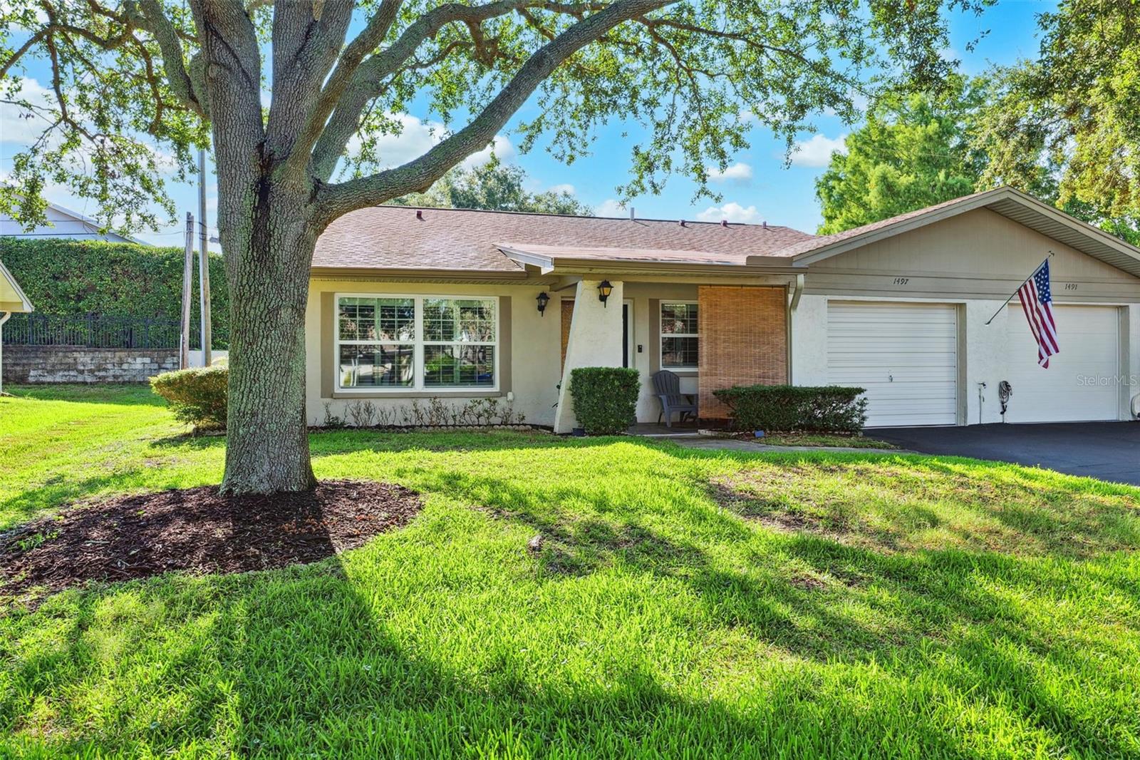 Located in the heart of Dunedin—one of Florida’s most charming and sought-after coastal cities—this spacious 2-bedroom, 2-bathroom villa offers the perfect blend of comfort, convenience, and peace of mind.
Set in a vibrant 55+ community, this home features a thoughtful split floor plan, offering privacy and space for both residents and guests. The bright and open living area flows seamlessly into a well-appointed kitchen, complete with built-in cabinetry, stunning quartz countertops, and brand-new appliances—ideal for everyday living and entertaining alike.
The guest bedroom is smartly designed with a built-in Murphy bed and desk, making it a flexible space for visitors or a home office. A full guest bathroom is conveniently located just across the hall. On the opposite side of the home, the primary suite offers a peaceful retreat with a large walk-in closet, walk-in shower, and ample vanity space. If that’s not enough, finish your day off sitting in your cozy screened in lanai!
Enjoy year-round comfort with a brand new A/C system, hurricane-impact windows and plantation shutters throughout, and the added protection of new gutters.
Just steps away from the clubhouse, and within easy walking distance to shops, grocery stores, and dining, this villa is perfectly situated for a convenient and active lifestyle.