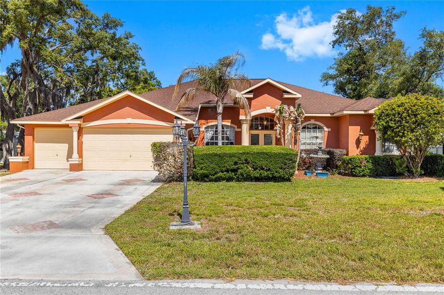 Pool home • Nearly half-acre fenced lot • 3D tour available. This 4-bedroom, 3-bath Spring Hill home offers 2,516 heated sq ft with a split floor plan, no HOA, no CDD, no carpet, and a 3-car garage. Welcome to 3051 Waterfall Dr where space, style, and Florida living come together on nearly half an acre with no HOA, no CDD, and no carpet anywhere in the house. From the moment you pull up, the grand columned entry, arched windows, and canopy of mature Spanish moss-draped oaks give this home a presence that stops buyers in their tracks.
Inside, 2,516 heated square feet of thoughtfully designed split floor plan living awaits with rich laminate flooring flowing through every single room, soaring ceilings, and natural light absolutely pouring in from every angle. The layout is as functional as it is beautiful: formal living room, formal dining room, a spacious family room, casual dining nook, AND a private French-door office/den whether you work from home or just need a space that isn't the kitchen table, this home has you covered.
The kitchen is built to impress granite countertops, stainless steel appliances including a large side-by-side refrigerator, center island with pendant lighting, pantry, and a layout that opens right into the family room so the cook never misses the conversation.
The primary suite is genuinely luxurious. We're talking a massive bedroom with a slider directly to the pool, dual vanities with stone counters, a chandelier-lit garden soaking tub, glass-enclosed walk-in shower with designer tile, arched windows, and walk-in closets. The three additional bedrooms are generously sized and served by two full bathrooms, true split floor plan privacy for guests and family alike.
Step outside and the covered screened lanai doesn't disappoint — oversized, ceiling fan equipped, and purpose-built for entertaining. The in-ground gunite pool anchors the backyard, which sits fully fenced with mature trees and more than enough room to breathe. And yes, there are two detached storage sheds out back for all the gear, tools, and Florida stuff that never quite fits in even a 3-car garage.
Major items are already done: Roof 2019, Water Heater 2022, block/stucco construction, indoor laundry room, and Flood Zone X, meaning no flood insurance required. Fiber optic internet available. Minutes from the Suncoast Parkway for an easy Tampa commute. Zoned for Deltona Elementary, Fox Chapel Middle, and Frank W. Springstead High School.
Homes with this combination of lot size, layout, updates, and amenities at this price point don't last. Schedule your showing today.