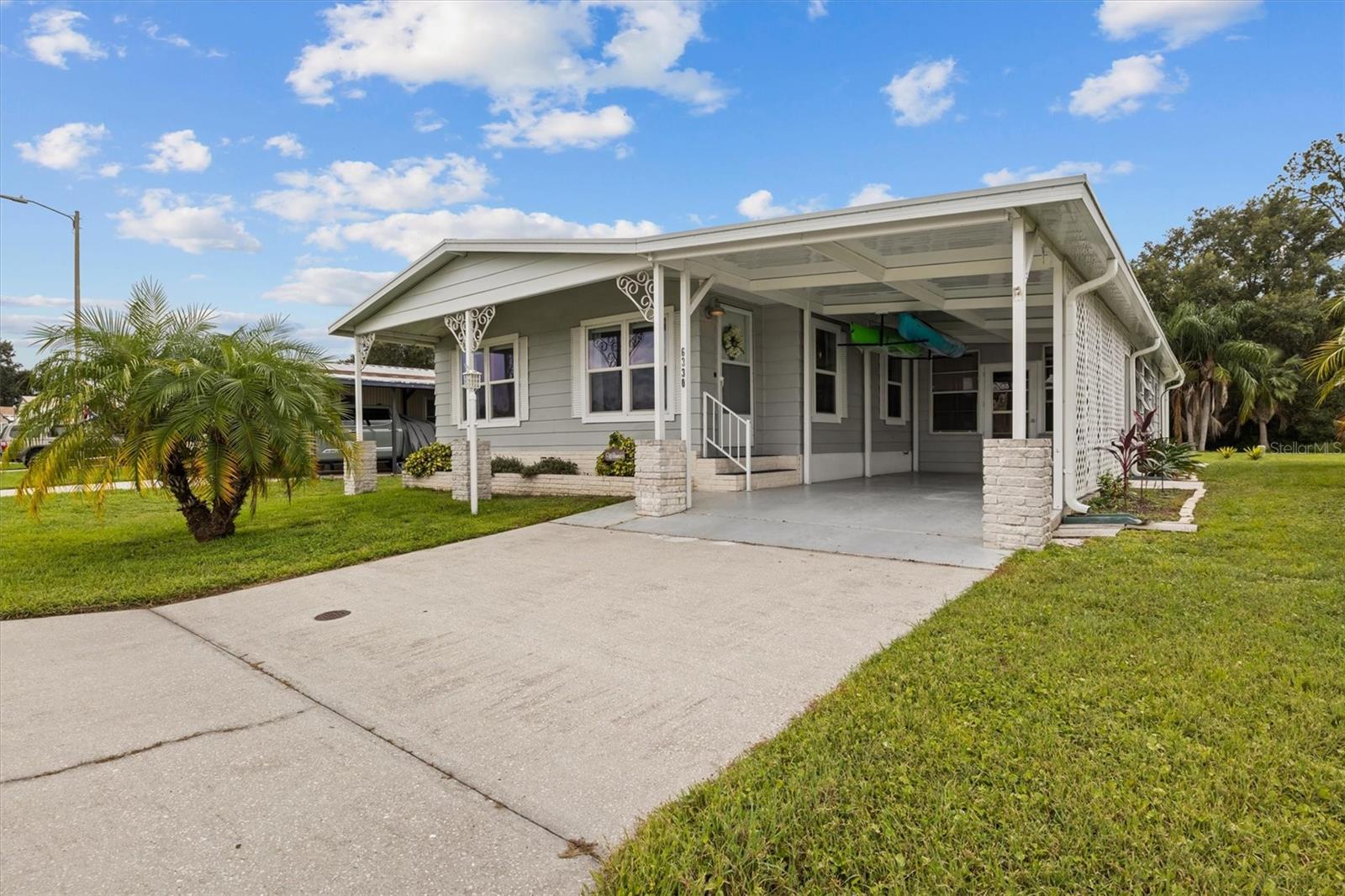 Welcome to 6330 Bayberry Blvd NE, located in the desirable 55+ community of Brookhaven in Winter Haven. This spacious 2-bedroom, 2-bathroom manufactured home sits on OWNED LAND with one of the lowest HOA fees around—just $34 a month. The home is being sold fully furnished, even including two kayaks, making it easy to start enjoying Florida living right away.
Step inside to find a bright and open floorplan with spacious living room and dining room with built-ins for additional storage space. The kitchen has been updated with a stylish backsplash, countertops, and a modern sink and faucet, while all appliances were replaced about seven years ago. The bathrooms have also received updates, including a refreshed vanity, countertop, and faucet. Additional upgrades include a metal roof on the main home (2021) and an updated roof over the carport and lanai (2023). The kitchen and bathrooms have updated luxury vinyl plank flooring. Portions of the interior have been repainted over the years, and carpeting was updated approximately six years ago.
Enjoy additional living space with the enclosed Florida room and a large shed/workshop for hobbies or storage. Step out the French doors to the back patio and take in serene views of your private backyard oasis with no rear neighbors—your very own sanctuary. This property is also pet-friendly, allowing up to two pets.
Brookhaven is a resident-owned, active 55+ community that offers fantastic amenities, including a clubhouse, swimming pool, and organized social activities, while maintaining one of the lowest monthly fees in the area. Conveniently located close to shopping, dining, medical facilities, and Winter Haven’s famous Chain of Lakes, this home is perfect as a full-time residence or seasonal retreat.
Don’t miss the chance to own this move-in ready home with unbeatable value in a sought-after community.