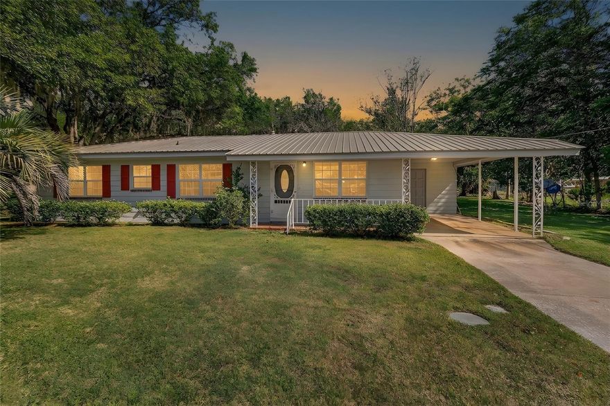 One or more photo(s) has been virtually staged. Welcome to this charming 3-bedroom, 2-bath home situated on just under half an acre in the heart of Williston. Built with solid block construction and a durable metal roof, this property offers the benefit of no HOA and no deed restrictions.

With 1,344 heated square feet and approximately 2,100 total square feet, the home provides additional functional space beyond the main living area. Inside, you will find terrazzo flooring throughout, with tile in the kitchen and bathrooms for easy maintenance. The kitchen features a cooktop, double oven, and natural gas connection, offering both functionality and efficiency. Ceiling fans are installed throughout the home.

The layout offers a comfortable flow from the living area into the kitchen and dining space, with a split-bedroom floor plan for added privacy. A Florida room located at the rear of the home provides additional space that can be used for relaxing, entertaining, or flexible living needs.

Additional features include a one-car carport and a dedicated laundry room with direct access to the kitchen. The property is serviced by city water and sewer.

Situated on 0.43 acres, the lot provides ample space for a variety of uses while still being conveniently located. The home is a short drive to both Gainesville and Ocala, offering access to shopping, dining, and everyday amenities. The surrounding area is also known for its proximity to natural springs and outdoor recreational opportunities.

This property presents a great opportunity for a primary residence, investment, or future customization.