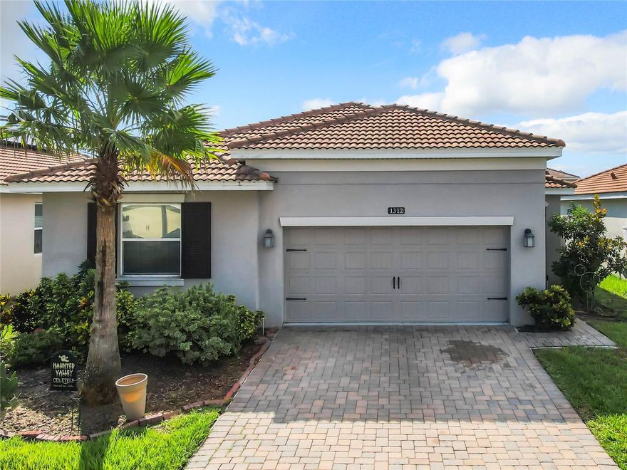 Discover your dream home in a resort-style community, just minutes from Disney World! This stunning 2019-built, one-story residence perfectly blends modern efficiency and carefree living. It features a durable tile roof and money-saving solar panels to reduce your utility costs. Inside, you'll find 4 spacious bedrooms and 2 modern bathrooms designed for comfort. Embrace an unparalleled resort lifestyle with exclusive access to: relaxing lazy river, state-of-the-art fitness center, vibrant playground for children. All this is nestled within a secure, guarded community. Its prime location offers easy I-4 access, placing you moments away from premier shopping, dining, and entertainment.