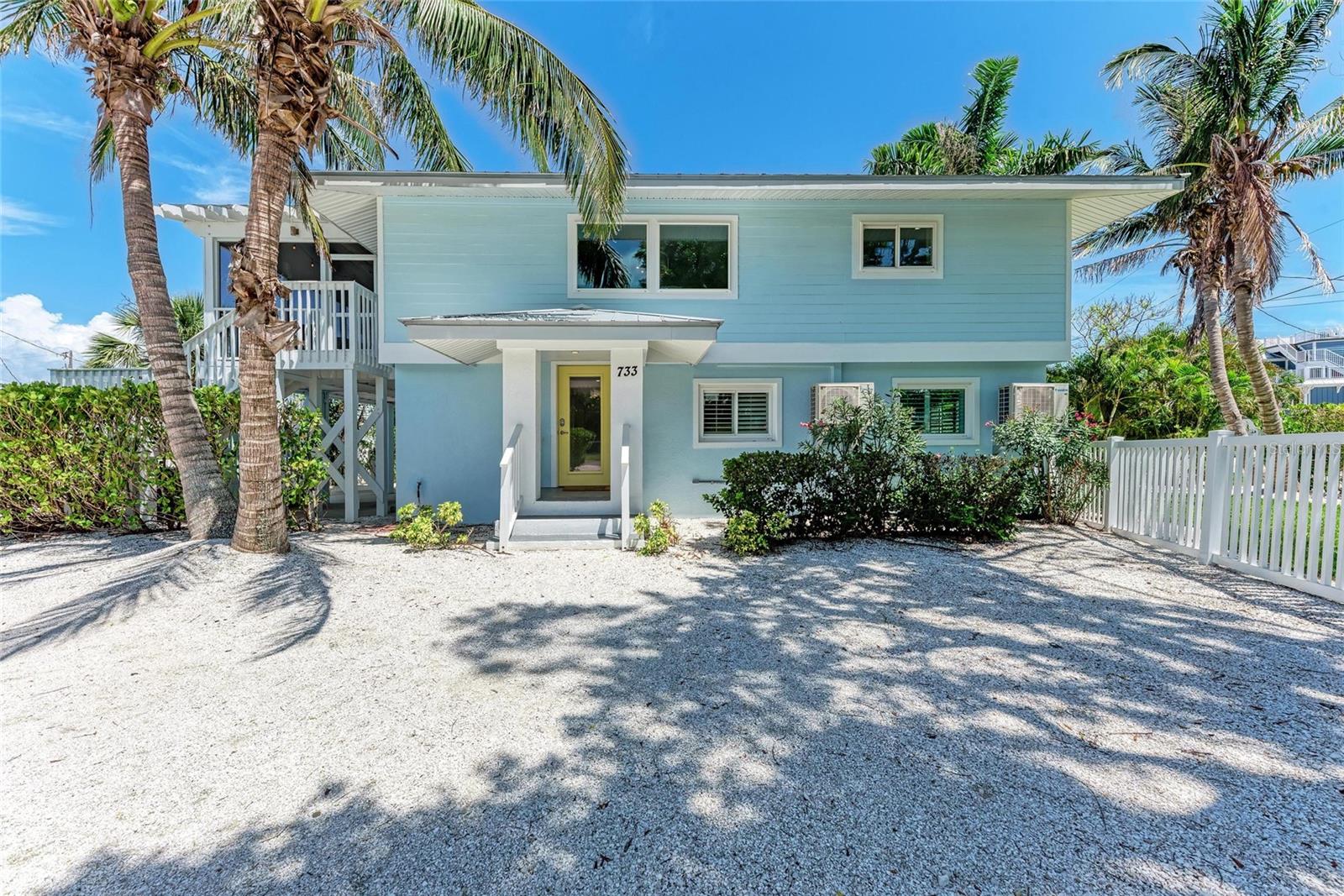 Welcome to Summer Breeze - A rare island gem tucked away on Anna Maria’s coveted North End! This elevated 5-bedroom, 4-bath coastal retreat sits on an oversized corner ¼-acre lot surrounded by lush tropical landscaping, just steps from the world-famous Bean Point beach. Whether you're seeking the ultimate family getaway or a high-performing investment property, Summer Breeze delivers. The thoughtfully designed floorplan offers incredible versatility: a spacious first-floor layout includes a cozy bunk room, a private guest suite, and an oversized Primary In-Law Suite featuring its own sitting room, luxury ensuite bath, and private pool entrance, perfect for guests or multigenerational stays.
Upstairs, the bright and breezy main living space welcomes you with an open-concept design ideal for entertaining. The coastal-inspired kitchen boasts granite countertops, ample storage, and a breakfast island that flows seamlessly into the dining area. The adjacent living room features charming finishes and opens to a large screened balcony, the perfect place to enjoy a sunset over evening cocktails or morning coffee. The second primary retreat offers its own ensuite bath and cedar walk-in closet, while another large bunk room in the back of the home adds even more flexible sleeping options. Best of all, this home is grandfathered in to accommodate up to 14 guests — a rare and valuable rental advantage in the area. Outdoors, your private tropical oasis awaits with a heated pool and spa, fenced yard, covered entertainment area, outdoor games space, and two driveways with ample parking. Elevated construction not only adds coastal character but also practicality, offering covered parking and elevated systems. Looking for some peace of mind? This home is move-in ready and turn-key! It comes fully furnished and loaded with updates, including: Hurricane-impact windows & doors, plantation shutters, newer metal roof, updated plumbing & electrical throughout, two new water heaters and AC units (elevated), and all new pool equipment & pool heater. Summer Breeze is currently operating as a successful vacation rental and brings in well over $150K annually, with bookings already in place, offering instant income for savvy investors. Just a short stroll to Anna Maria’s sugar-sand beaches, iconic Bean Point, Pine Avenue shops, and beloved local eateries, Summer Breeze captures the essence of laid-back island living with serious investment potential. Don’t miss this exceptional opportunity to own FLORIDA PARADISE on AMI’s North End!
