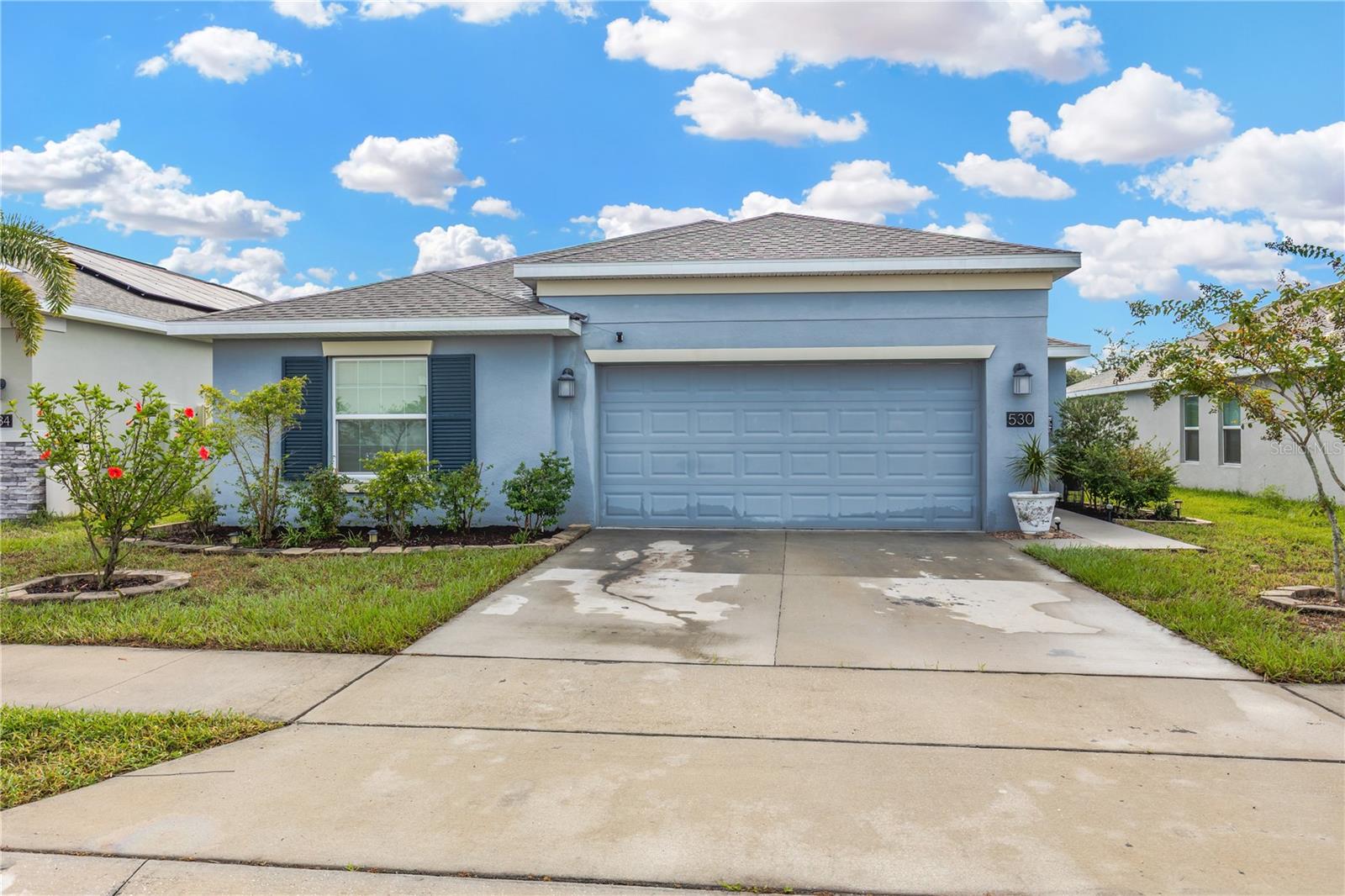 Welcome to this immaculate, like-new single-family home located in the heart of Bartow, Florida. Built in 2021, this stunning property offers the perfect blend of modern design, comfort, and energy efficiency. Step inside and be captivated by the open-concept floor plan, where high ceilings and abundant natural light create an inviting atmosphere. The gourmet kitchen is a chef's delight, featuring sleek stone countertops, stainless steel appliances, and a large center island perfect for meal prep and entertaining. The seamless flow from the kitchen to the family room makes this home an entertainer's dream. This spacious home boasts 4 bedrooms and 2 bathrooms, providing ample space for families or guests. The primary suite is a true retreat, offering a tranquil sanctuary with a spacious walk-in closet and a luxurious en-suite bathroom with dual sinks. Beyond the interior, this home is built with sustainability in mind, featuring a solar power system to help offset electric bills. The property also includes a 2-car garage for convenience and additional storage. The meticulously maintained backyard is fully fenced with vinyl fencing, providing a private oasis for outdoor gatherings. Located in the serene Liberty Ridge community, you'll enjoy a peaceful lifestyle while still being in close proximity to major hubs like Winter Haven, Lakeland, and Tampa. This community is also known for its patriotic monument, honoring those who have served our country. Don't miss the opportunity to own this beautiful, move-in-ready home. Schedule your private tour today and experience the best of Florida living!