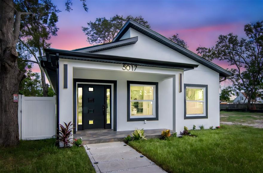 One or more photo(s) has been virtually staged. BRAND NEW Construction in Gulfport – Modern, Stylish & Move-In Ready! Not in flood zone. Welcome to this beautifully designed shotgun-style home— with a smart, efficient use of space—located just minutes from downtown Gulfport and the vibrant energy of St. Pete. This 3-bedroom, 2-bath gem is the perfect blend of form and function. Step inside to an open-concept floor plan filled with natural light, finished in today’s trending colors and sleek, modern touches. The spacious living room is anchored by a striking decorative electric fireplace—both stylish and cozy. The kitchen opens seamlessly into the main living area, ideal for entertaining and everyday living and featuring ceiling accent lighting and a large pantry closet. The private master suite features a generous walk-in closet and a spa-like bath with dual vanities and contemporary finishes. A large inside laundry room offers added convenience and includes built-in storage cabinetry. Enjoy the oversized 1-car garage located at the rear of the home—perfect for secure parking, bikes, beach gear, or additional storage. Conveniently located just minutes to downtown St. Pete, Gulfport’s artsy waterfront district, and the sugar-sand beaches of St. Pete Beach. This is Florida living at its best—with none of the flood zone worries! Don’t miss this opportunity to own a brand-new home in one of Pinellas County’s most sought-after areas!