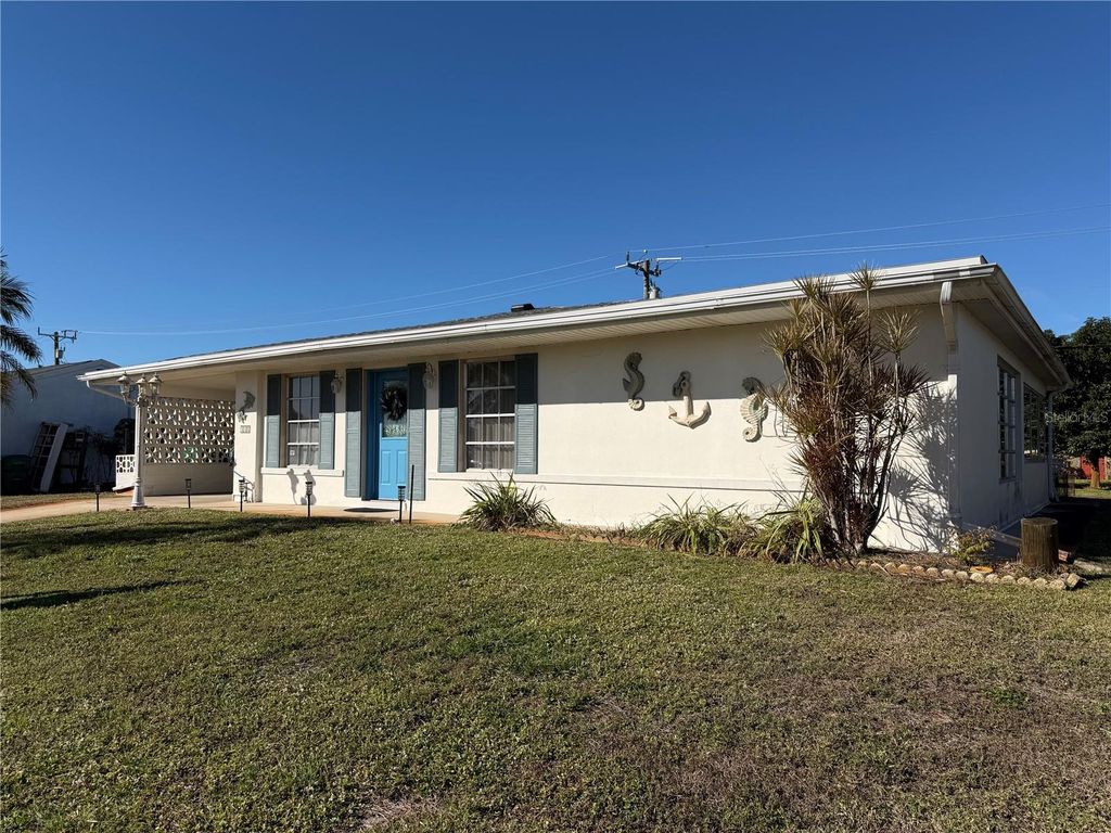 Photo of 330 Lasayette Drive NE, Port Charlotte, FL 33952 (MLS # C7520445)