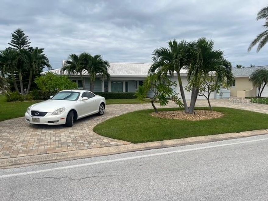 Newly remodeled and meticulously updated, this stunning 3-bedroom, 2-bath pool home is the epitome of Florida living. The inviting open floor plan connects the main living areas, providing a seamless flow for everyday life and entertaining. A formal dining area offers a dedicated space for meals with family and friends. The spacious kitchen features modern appliances and a clean, fresh look.

Retreat to the owner's suite for a peaceful escape. Two additional bedrooms provide flexibility for guests, a home office, or a growing family. Enjoy the convenience of an in-home laundry room and a 2-car garage for storage.

Step outside to your private oasis. The backyard features a beautifully heated pool and a covered patio, perfect for relaxing or dining al fresco. This home is ideally located close to the beach, a variety of restaurants, and vibrant entertainment options.