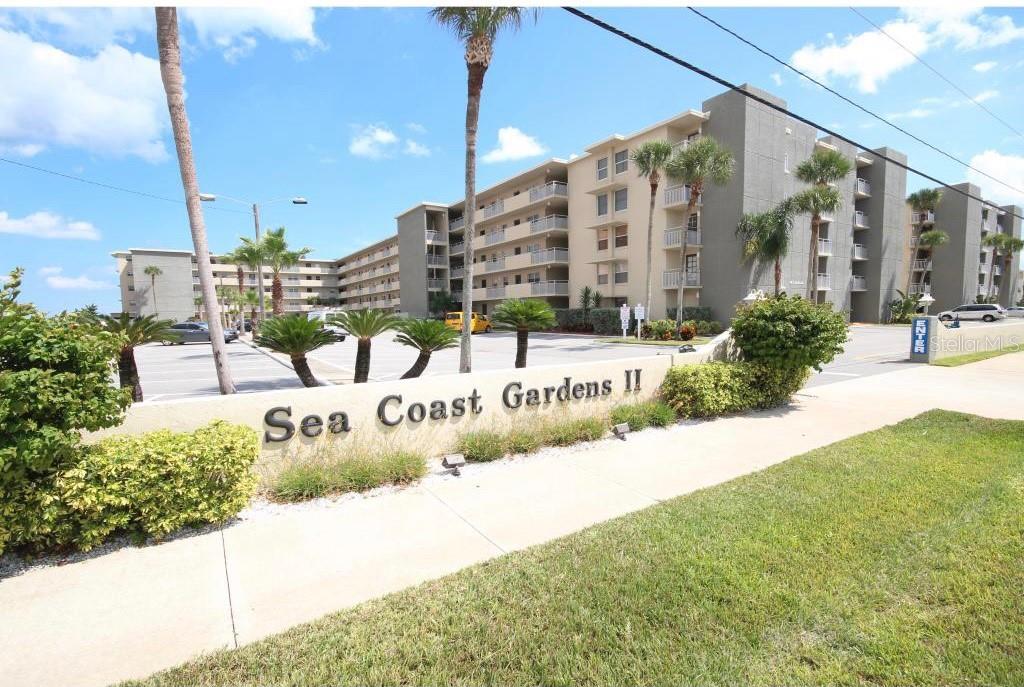 Beautifully appointed and newly renovated in 2019 this 2-bedroom 2 bath **OCEANFRONT** condo on the sought-after **NO DRIVE BEACH** located in the most desirable Sea Coast Gardens II condominiums! You will be so impressed when you walk into this open and spacious condo enhanced by being a corner unit where you have direct views of a white sandy beach in multiple directions!! Venture out into a **PRIVATE BALCONY** and experience breathtaking sunrises and finish your day with refreshing and breezy views of the Atlantic Ocean. For the chef in the family, enjoy this fully equipped open kitchen with **GRANITE** countertops complimented with stainless steel appliances. Luxury vinyl plank flooring is throughout this unit highlighted by new furniture and furnishings that are all included. Sleep 6 people comfortably as you have a king in the master bedroom and twin bunk beds and a queen in the 2nd bedroom. As a bonus, cuddle up to your own unique corner **FIREPLACE** to keep you warm on those cool and breezy beach nights during the winter months. Both bathrooms are fully renovated with updated plumbing fixtures and flooring as well. **NEW A/C 2021 JUST INSTALLED** In the community courtyard, enjoy two **OVERSIZED** pools where you can relax and cool off in these hot Florida days! Don’t forget the night life you will love for a 5 minute drive to Flagler avenue in the heart of New Smyrna Beach taking in the sights of artsy shops and locally owned restaurants that are sure to satisfy the most discriminating tastes! If earning extra revenue is important, you won’t find a better unit to rent all year long at top rates! ;LocationDescription: Condo