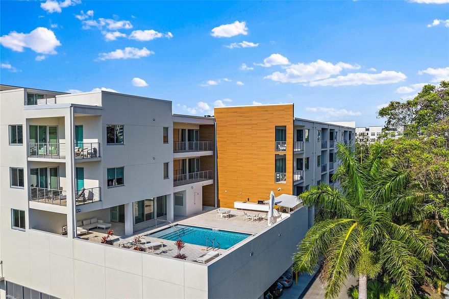 Artful retreat in the middle of everything.  Enjoy all downtown Sarasota and the Rosemary District has to offer. This top floor 1 bed, 1 den, 1 bath luxury condo features 1,082 sq. ft. of open concept living space, airy 10'-11' ceilings, spacious south-facing terrace with views of the gulf and city skyline. Natural light pours into the condo filling it with light and energy. The kitchen features a clean, modern design with stainless steel appliances, convection oven, quartz countertops, and in-unit washer/dryer. Residents will enjoy amenities and features including: fob entry, elevator access, covered assigned parking, rooftop pool deck with outdoor shower, and open terrace for grilling all while overlooking both the city and gulf. The building is one only minutes to Whole Foods the farmers market, ample shopping, dining and 2.5 miles to the beach. New build completed 2021. This condo is available immediately. Schedule your private tour today!