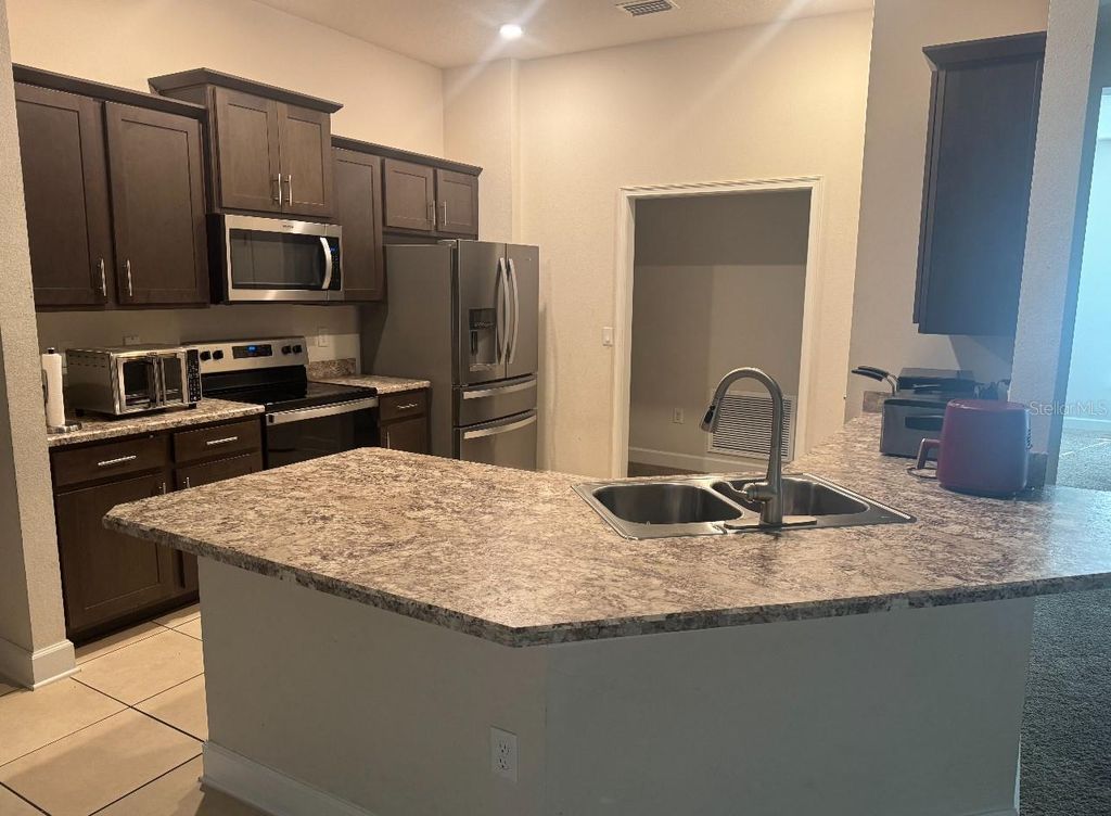 Photo of 333 Ashton Woods Lane, Leesburg, FL 34748 (MLS # O6342362)