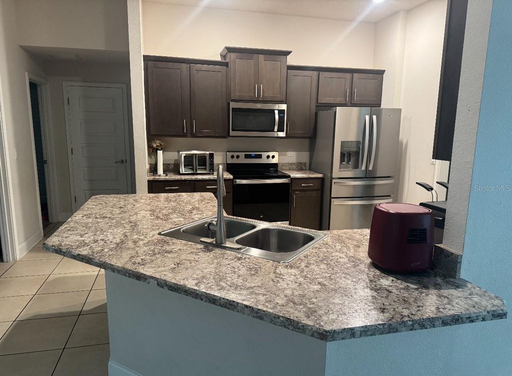 Photo of 333 Ashton Woods Lane, Leesburg, FL 34748 (MLS # O6342362)