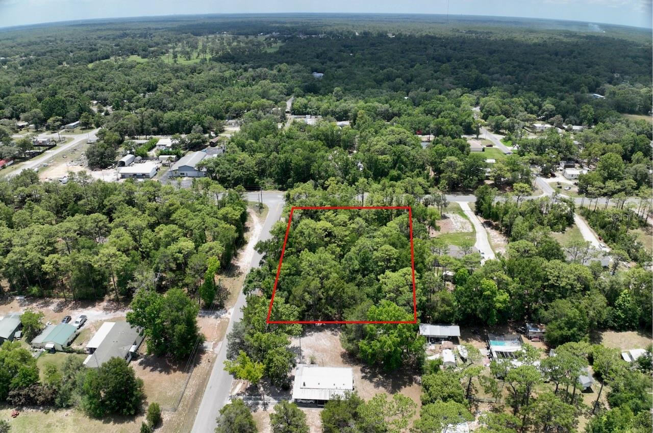 Versatile, high and dry corner lot in Homosassa—ideal for builders or buyers looking for a safe, long-term investment. Zoned low-density residential with both single-family and manufactured homes allowed, offering maximum flexibility and low holding costs: no HOA, no CDD, no deed restrictions, low impact fees, and low taxes. Great access via local roads, with Hwy 98 and Veterans Expressway just minutes away—making Tampa, Crystal River, and Lecanto easily reachable. Surrounded by growing amenities: shopping, restaurants, medical centers, plus nearby fishing, boating, and hiking in Homosassa Springs. Whether you’re ready to build or looking for a secure place to put your savings, this lot delivers location, freedom, and solid fundamentals. Buyer to verify all details.
