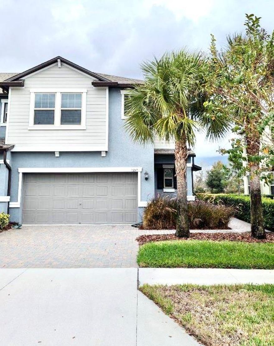 Welcome home to this spacious move-in ready Florida resort style 3 bedrooms, 2 full baths, 1 half bath, 2 car garage, end unit with a WATER view townhouse nested in the sought out community of Connerton in the heart of Land O' Lakes. Walk through the brick paved driveway up to the side entrance into an OPEN FLOORPLAN featuring ceramic tile flooring throughout the first floor, dual-pane windows, and kitchen overlooking the spacious living and dining combo. Private powder room across the hall with vanity and window. Kitchen features granite countertops, 36" inch cabinets, stainless steel appliances, walk-in pantry, along with an extended island with enough space for bar stools perfect for additional seating when gathering. All bedrooms are upstairs. Upstairs opens up to a spacious LOFT with bedrooms nested on both sides. Owners retreat offers expanded walk-in closet, en suite master bath with walk-in shower, dual sinks, granite countertops and full width 42" high vanity mirror. Across the hall sits a separate and quiet laundry room, full bath with tub, and secondary bedrooms overlooking the WATER and preserved woods. Full of amenities offering resort style swimming pools, fitness center, cafe, playground, meeting rooms, and tennis courts. Close to shopping, schools, highway and restaurants.
