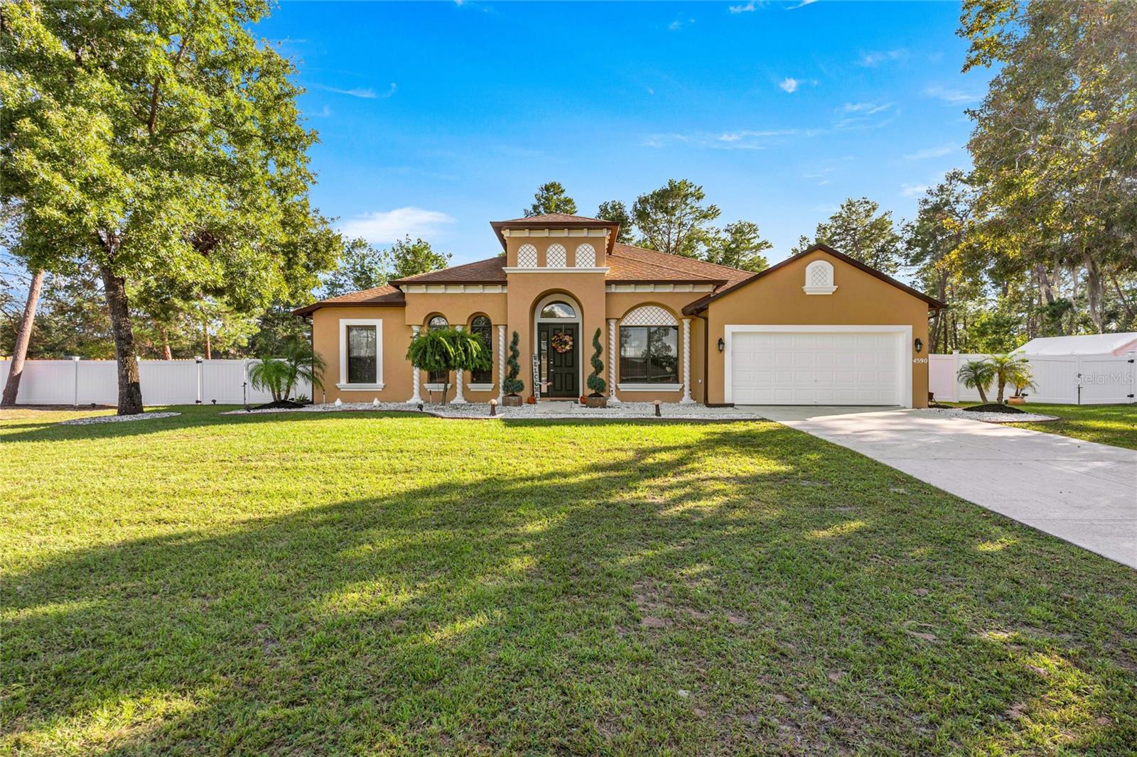 WELCOME HOME to this meticulously well maintained home offering a perfect blend of comfort, space, and privacy! Nestled in a peaceful setting near Santos State Park, this property provides the ideal escape while still being close to everything Ocala has to offer. Step inside to find high ceilings, a spacious open-concept living area filled with natural light just perfect for relacing or entertaining. The home has been lovingly cared for and shows great pride of ownership. The well appointed kitchen boost updated epoxy counter tops with laminate, updated stainless steel appliances. Luxury LVP throughout the house. Three large updated bathrooms for added convenience. Step into your expansive back yard fenced on both sides with natural boundary along the back to give a peaceful setting. Enjoy the added landscaping and garden beds around the exterior. Don’t miss your chance to own this gem and schedule your private tour today!