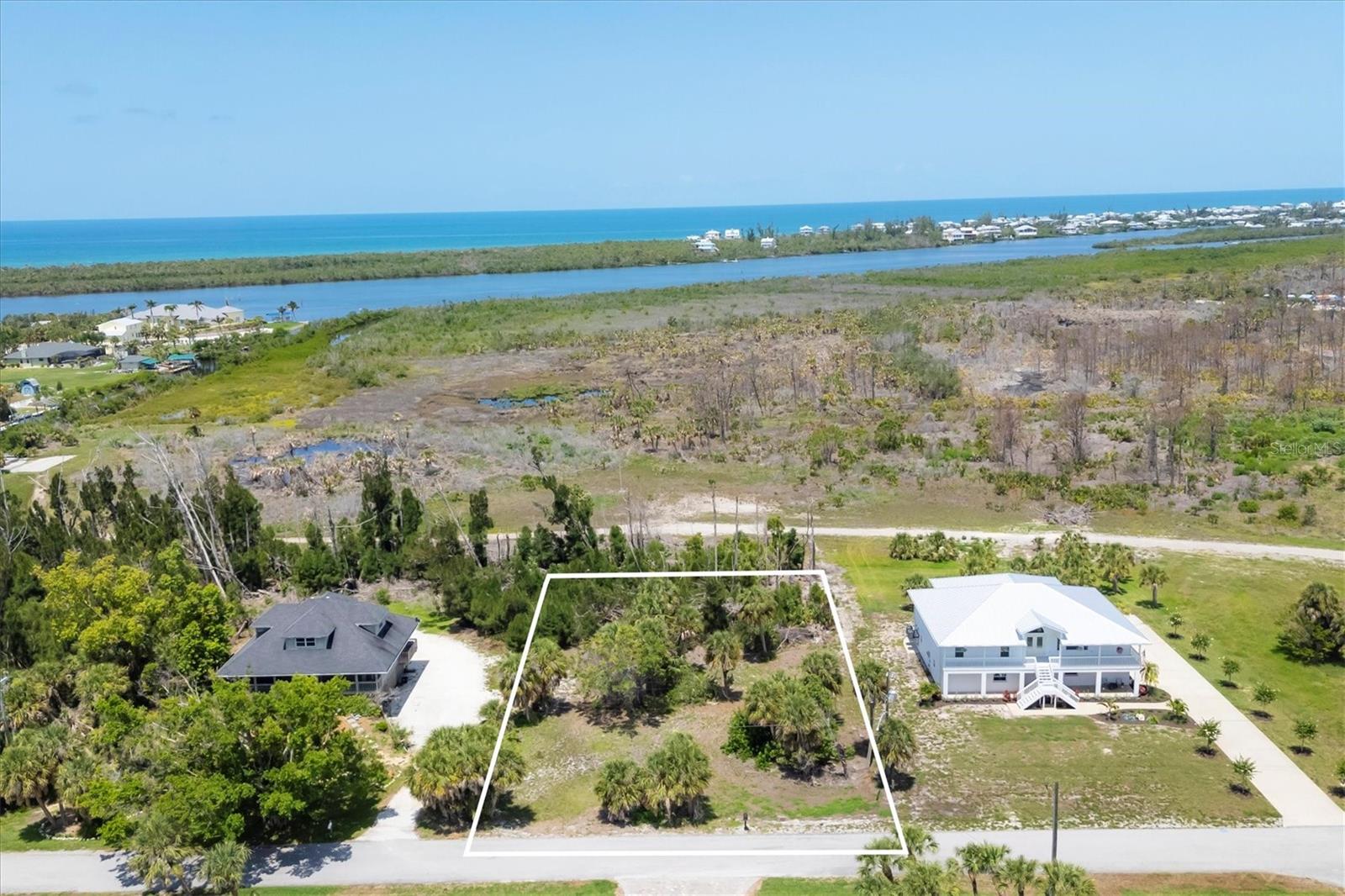 Fantastic large vacant homesite in the historic Vanderbilt developed neighborhood of Cape Haze. On a quiet street that backs up to the serene Don Pedro State Park. At over .55 acres you have all the room to build a tropical retreat of almost any size. There are no restrictions on when you need to build and no restrictions on what style home you can build. The neighborhood offers a variety of classic vintage Florida homes, newer construction properties, and mega-mansion waterfront estates. Stroll the banyan lined streets, bicycle or golf cart to nearby shopping and restaurants on the large sidewalk along Placida Rd. The property is only minutes to historic Boca Grande, three full service marinas, public and private golf courses, miles of tranquil sandy beaches and world-class fishing and boating.