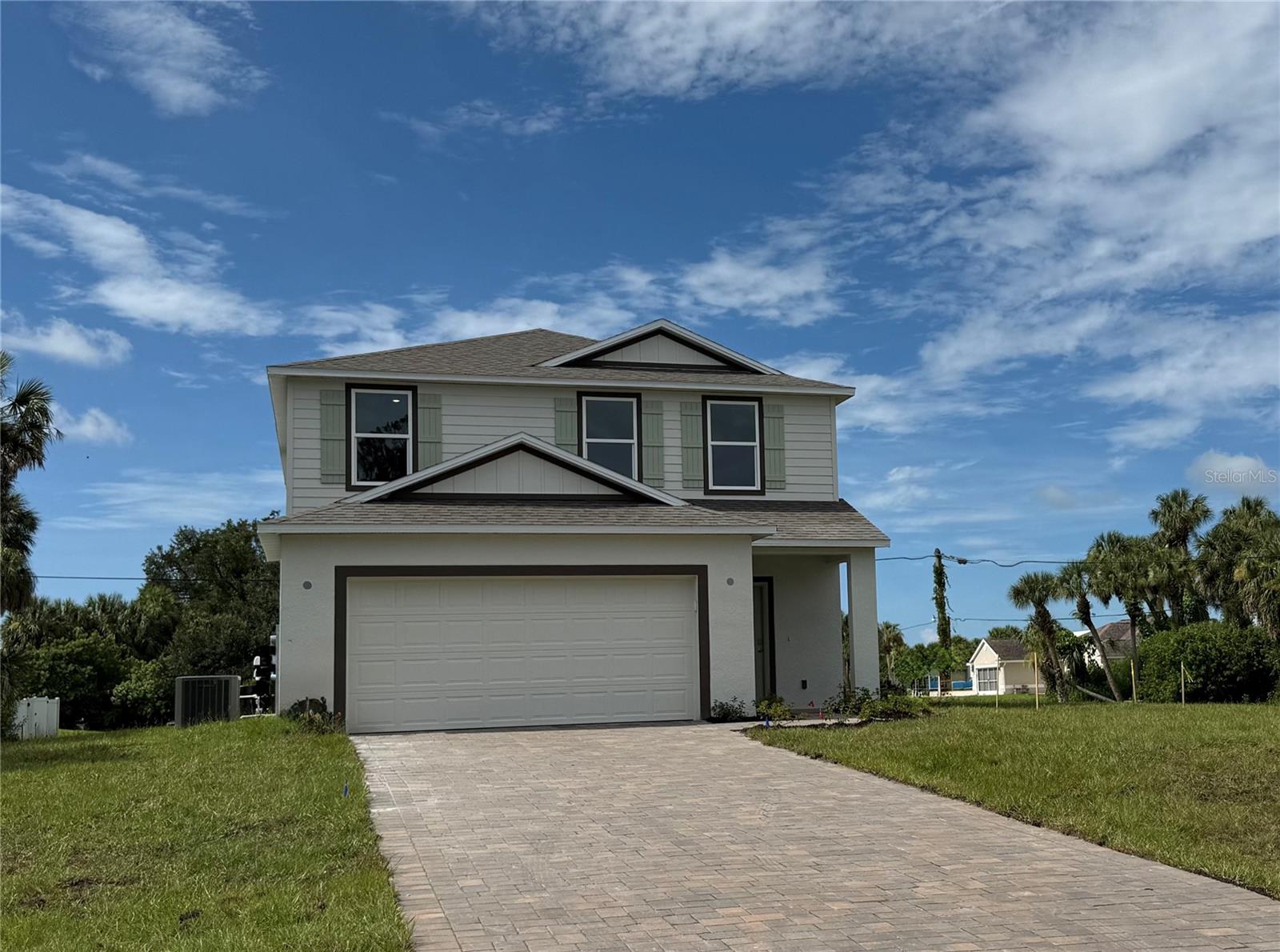 Under Construction. Known for its abundance of parks and the scenic Myakka State Forest, North Port offers residents a lifestyle filled with outdoor adventures and recreational opportunities. The city’s ideal location also provides easy access to shopping, dining, and top-rated schools, making it the perfect place to call home.
Introducing "The Lancaster", a stunning two-story home built on a prime corner homesite, and a gem within our Heritage Collection. This residence seamlessly blends timeless elegance with modern comfort, featuring an upscale paver driveway and entry walk, offering outstanding curb appeal.
Step inside to an inviting open foyer that leads you into thoughtfully designed living spaces. The main floor boasts a spacious open-concept layout, seamlessly connecting the modern kitchen, dining area, and great room. Upgraded impact windows throughout the home enhance safety and energy efficiency, while soft-close shaker cabinets with granite countertops in the kitchen provide both elegance and functionality. The kitchen is further enhanced by stainless steel appliances, perfect for culinary adventures and everyday gatherings. Ceramic plank tile flooring in the main living areas adds durability and style, and upgraded LED lights in the great room create a bright, welcoming atmosphere.
This home is thoughtfully designed with the highly desirable 4th bedroom and full bath located on the first floor, offering flexibility for guests or multi-functional use.
The second floor features a spacious loft area, ideal for a media room, office, or relaxation space, and is highlighted by designer railings that add a touch of sophistication. The master suite serves as a luxurious private retreat, complete with an ensuite bathroom featuring a walk-in tile shower with a shower enclosure, offering a spa-like experience. The master also boasts a spacious walk-in closet for ample storage.
The exterior of The Lancaster reflects the enduring charm of the Heritage Collection with architectural details that add character to the home’s facade. Driveway pavers and entry walk pavers enhance the overall curb appeal. The home is also equipped with an irrigation system for easy lawn maintenance and lush landscaping.
A 2-car garage and full screened patio complete the functional layout of this beautifully crafted home, offering ample space for parking, storage, and outdoor living.
Experience the perfect blend of classic design and modern amenities in The Lancaster, a home ideal for those who seek both style and comfort.