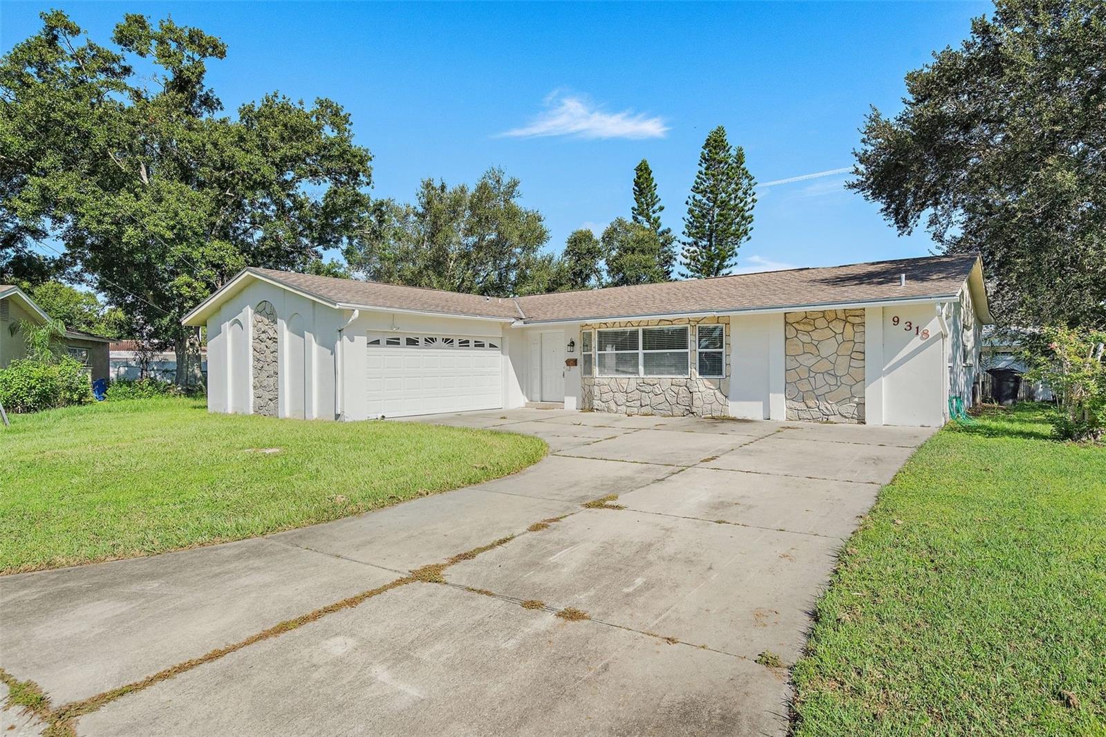 CHARMING 3-BEDROOM, 2-BATHROOM HOME WITH 2-CAR GARAGE in St.PETERSBURG!
Welcome to 9318 1st St N, a beautifully maintained single-family residence nestled in Sun Plaza Isles on a cul de sac. This spacious home offers comfortable living with an open, split floor plan perfect for both everyday life and entertaining.
Enjoy the convenience of the large 2-car garage with storage space throughout. The bright and airy interior features plenty of natural light, a functional kitchen, and cozy living areas. Step outside to a private backyard, ideal for relaxing or gatherings.
Located close to schools, parks, shopping, and dining, this home combines comfort and location in one desirable package.
Don't miss your chance to make this lovely St.Pete property your new home!