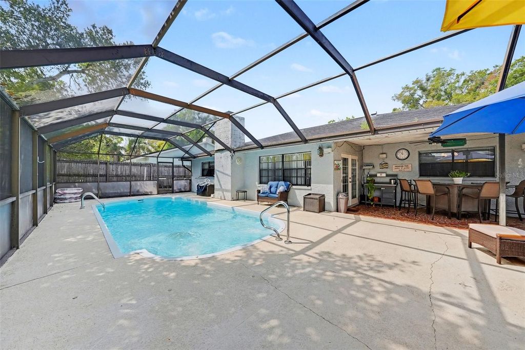 Photo of 8731 Woodcrest Drive, Port Richey, FL 34668 (MLS # TB8490789)