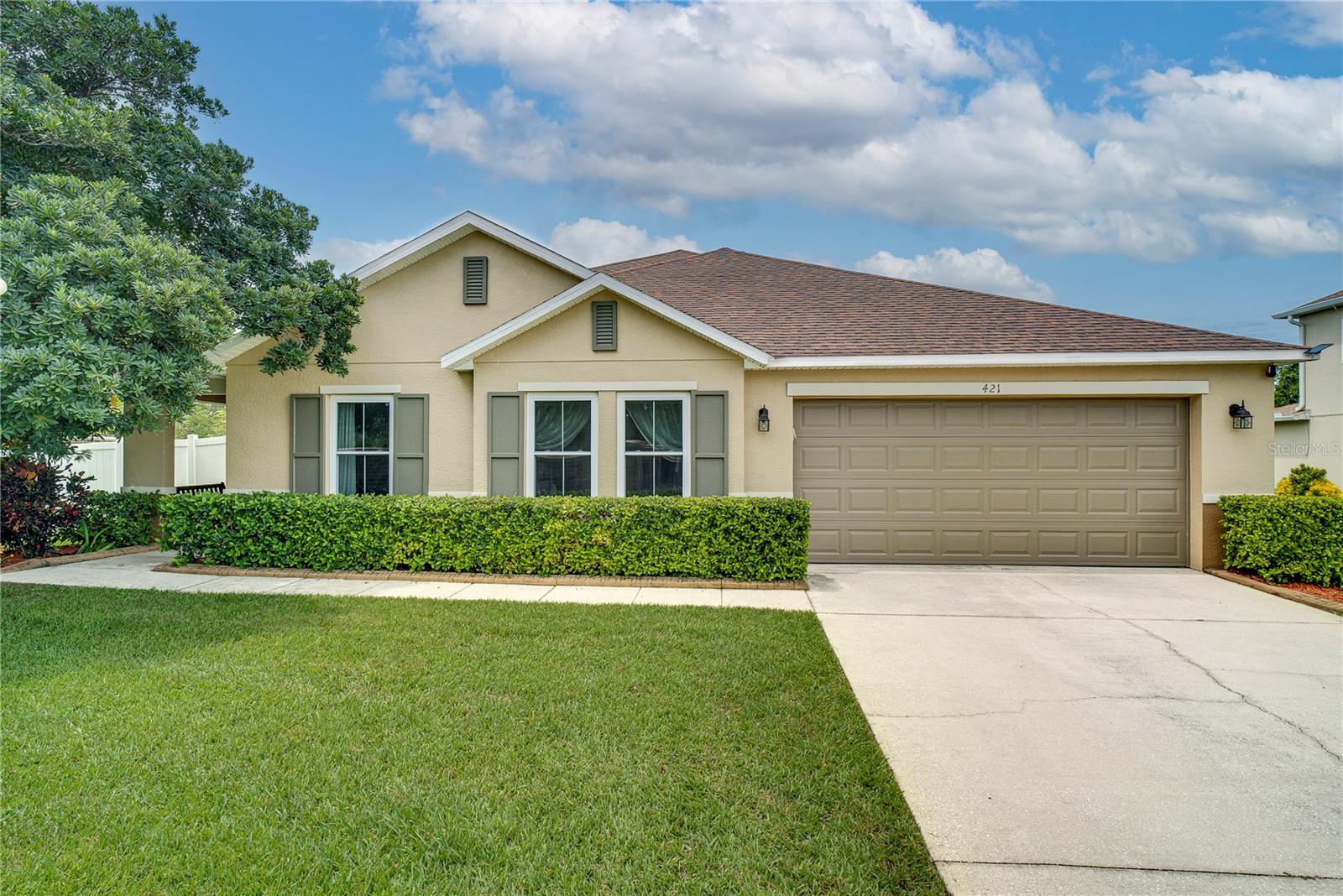 One or more photo(s) has been virtually staged. Welcome home to your NEW upgraded 3-bedroom, 2-bathroom home on an oversized lot just under ½ acre-the largest in the neighborhood-located conveniently next to the Winter Garden Village with access to Target, Best Buy, Lowe's, Ulta, LA Fitness, and much more. Built in 2008, this home features a freshly painted exterior (Aug 2025) and all-new high-efficiency, solar-tinted,
double-pane vinyl windows (May 2025). Inside, you'll find premium faux wood plank tile flooring and custom baseboards throughout (2021), a fully renovated common bathroom (2025), and a remodeled primary bathroom (2021), both with high-end toilets and fixtures. The kitchen is equipped with appliances less than 2 years old, and the laundry room was upgraded with a sink and custom millwork in 2021. The high-efficiency SEER-rated HVAC system with Variable Frequency Drive was installed in 2021. Enjoy outdoor living with a hurricane-hardened PVC fence featuring steel-embedded concrete posts, a large aluminum swing gate, and a separate man gate. Additional features include Grobe and Moen faucets, a full ADT security system with 2 cameras (service ready to reactivate), a new Ring doorbell (May 2025), and added attic access. Ideally situated near the Turnpike, 429, 408, and West Colonial-this home offers space, style, and unmatched location.