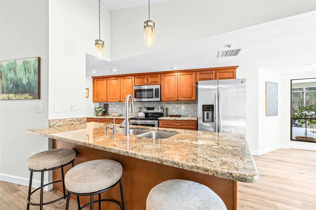Photo of 1440 Wetherington Way, Palm Harbor, FL 34683 (MLS # TB8436876)
