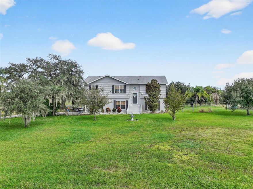 Welcome Home to 301 HL Smith Rd, Haines City, FL 33844

Tucked away on a peaceful stretch of Haines City countryside, this property isn’t just a home—it’s a lifestyle. Imagine waking up each morning surrounded by open skies, fresh air, and the kind of quiet that only comes with country living, yet knowing every modern comfort is waiting for you inside.

Step into 1,776 square feet of living space designed with both function and style in mind. The split floor plan offers 4 spacious bedrooms and 3 full bathrooms, perfectly balancing privacy with open gathering areas.

At the heart of the home, the kitchen has been fully updated with stainless steel appliances, granite countertops, and soft-closing cabinets, making it as practical as it is elegant. Each bathroom has also been beautifully renovated with granite counters, upgraded finishes, and a fresh, modern look, providing a true move-in-ready experience.

The primary suite is your private retreat with its own en-suite bath, while the additional bedrooms offer flexibility for guests, a home office, or a growing family. Natural light flows throughout, creating an open, welcoming feel in every room.

Beyond the walls, this property truly shines. Thoughtful updates include solar panels for energy efficiency, two water softener systems, a new well pump, and a new drainfield, giving you peace of mind for years to come. Outside, you’ll find a barn with 30 AMP service and a 30 AMP RV hookup in the driveway, ideal for equipment, hobbies, or your next adventure.

The expansive lot provides room to dream, grow a garden, build a pool, raise animals, or simply enjoy wide-open views under the Florida sky.

And when it’s time to venture out, convenience is at your doorstep. Haines City offers shops, dining, and local favorites just minutes away, with even more growth ahead. A **brand-new mall featuring a Target Supercenter and additional retail options** is coming soon, adding even more value to this location.

Quick access to US-27 and I-4 makes commuting simple, connecting you easily to Orlando, Tampa, and Lakeland.

301 HL Smith Rd isn’t just a property—it’s a story waiting for its next chapter. A place where modern updates meet country charm, where every detail has been cared for, and where your vision for home can truly come to life.