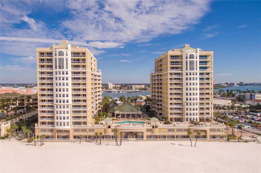 Experience relaxed coastal living with refined comfort in this rarely available 2-bedroom, 2-bath corner residence at the Mandalay Beach Club, located directly on the sugar-white sands of Clearwater Beach. Situated on the 4th floor, this spacious condo features a desirable split-bedroom layout, hardwood flooring throughout, custom cabinetry in both bedrooms, open space and two private balconies offering beautiful Gulf views. With northwest and northeast exposure, enjoy peaceful morning sunrises and unwind with seasonal sunsets over the water.

The open-concept living and dining area is filled with natural light from floor-to-ceiling windows, creating an airy and welcoming atmosphere that flows effortlessly to the expansive balconies—perfect for morning coffee or evening relaxation. Thoughtfully designed for both comfort and privacy, each bedroom features an en suite bath, making the home ideal for full-time living or hosting guests.

Mandalay Beach Club is one of Clearwater Beach’s most sought-after communities, offering resort-style amenities including a beachfront heated pool and spa, beautifully appointed clubhouse with kitchen, fitness center with sauna and showers, billiards room, grilling stations, climate-controlled storage, assigned under-building parking, and 24-hour guarded security with on-site management.

Just steps from Pier 60, residents enjoy easy access to award-winning dining, boutique shopping, water activities, and the lively local culture along with nightly sunset celebrations and popular annual events such as the Sugar Sand Festival. With Tampa International and St. Pete-Clearwater airports conveniently nearby, this residence offers the perfect balance of tranquility, convenience, and coastal charm.

Whether enjoyed as a primary home or a beachfront retreat, this condo presents a wonderful opportunity to own in one of Clearwater Beach’s most exclusive and well-loved communities.