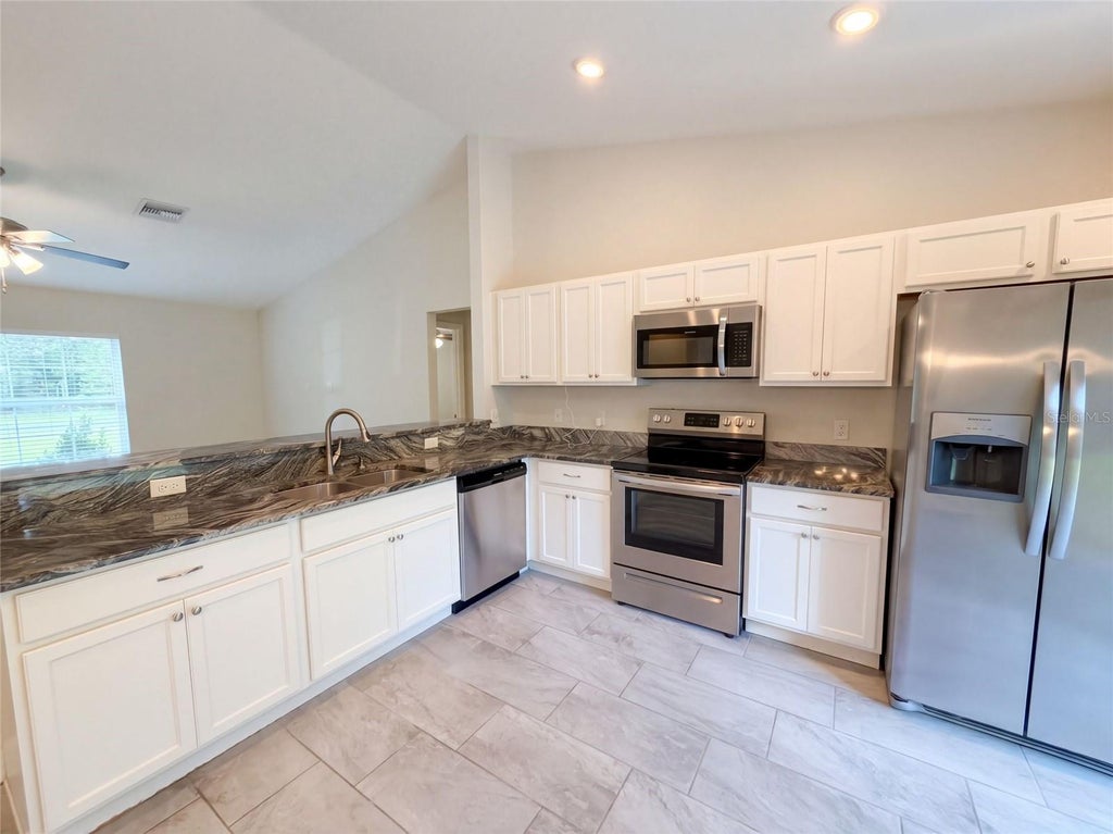 Photo of 5209 SW 128th Place, Ocala, FL 34473 (MLS # O6444673)