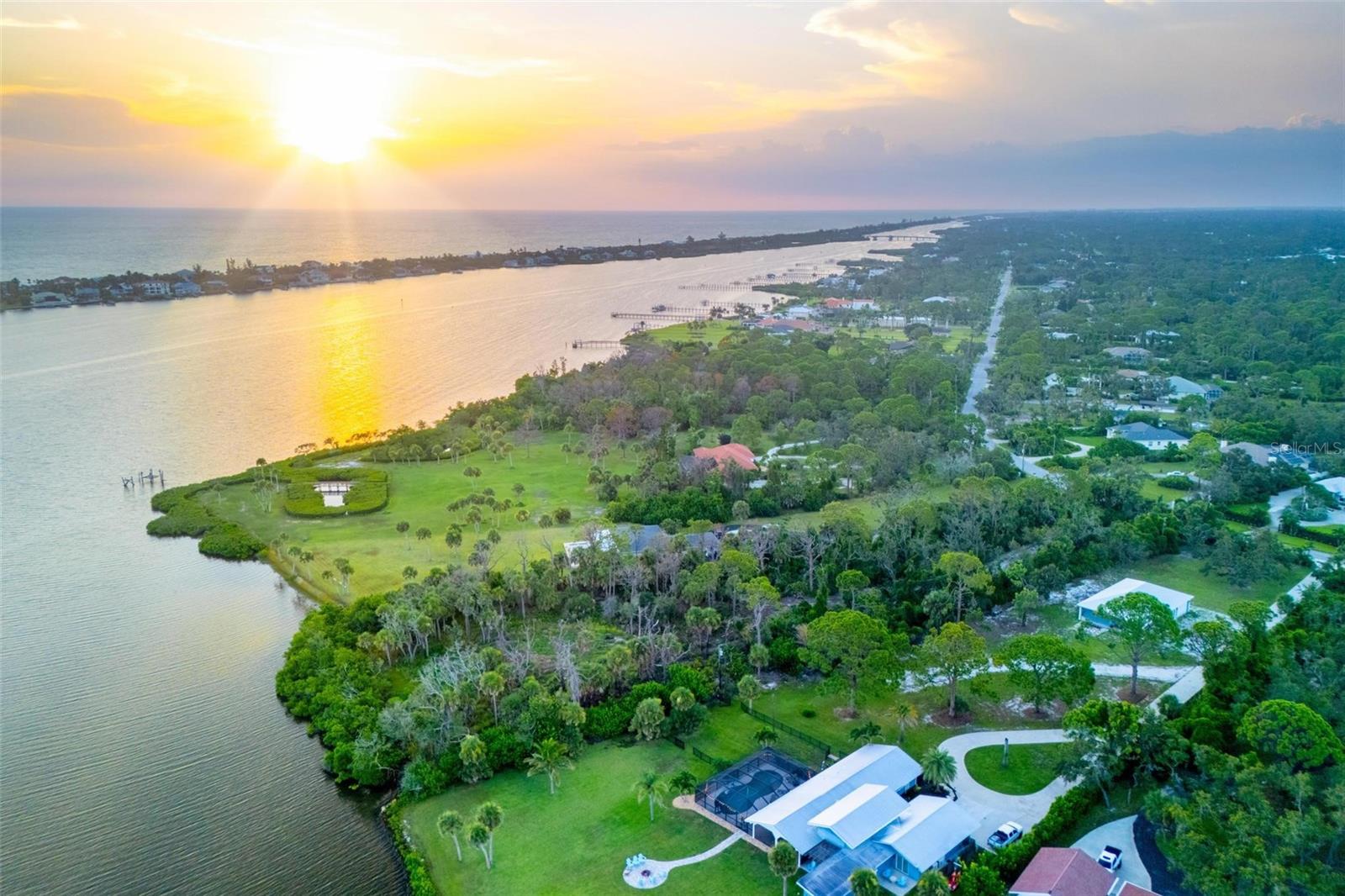 Over 2 Acres Bayfront — A remarkable site to build your dream estate, complete with guest house, pool, and room for tennis courts. Elevate your home above the mangroves to capture spectacular panoramic views of Lemon Bay. Located in a coveted neighborhood where leading contractors have chosen to live, this property offers both privacy and prestige. This exceptional site invites you to design a home that fully embraces stunning sunsets and tranquil bayfront living. Build a private dock, launch your kayak or paddleboard and enjoy immediate access to calm waters. The property can also be divided into two premium building sites, providing flexibility for your plans. Zoned VE13 and AE12, with public utilities available and gated access in place for added security and exclusivity. Just minutes from Manasota Key Beach, fine dining, historic Old Englewood, and cultural attractions, this location offers quiet waterfront privacy alongside convenient access to the best of Southwest Florida living. Seize this rare opportunity to create your own coastal retreat—an exceptional setting for a lifestyle defined by nature and leisure.