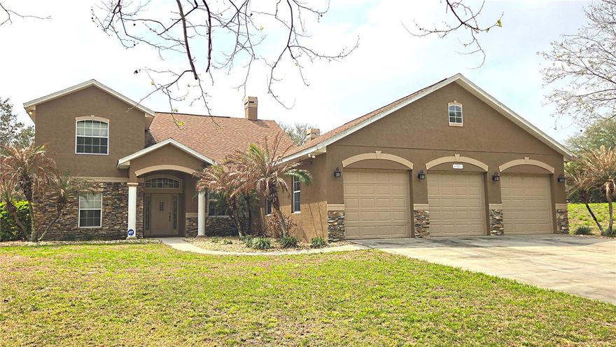 *** AMAZING OPPORTUNITY ALERT ***  Are you looking for updated home with some land and room to breathe? A house you can store ALL your adults toys like a boat...trailer...motorcycles...4 wheelers....jet ski? This amazing home has all that and more!  This wonderful home in beautiful Mt. Dora offers you  3 bedrooms, 2 bathrooms,  a separate office and a large 15x13 loft sitting on just over 1 acre of cleared land...but thats not all ! This home also offers you an oversized 3 car garage as well as an 840 squ. ft. outbuilding with double roll up doors for you to work on your "project car" or to store your toys...or make it the ultamate man cave! Inside you will find a large kitchen with granite counter tops, a kitchen island with storage, and a dining area. The large family room has a woodburning stone fireplace and 2 story vaulted ceiling! The primary bedroom has a double sided fireplace, walk in closet. The primary bathroom features double split vanities with granite tops, a jetted garden tub, and a true walk-in shower! On the other side of the house you have 2 more bedrooms, and an open flex space with a built in desk. Upstairs you have a dedicated office and a 15 X 13 loft that overlooks the family room. There are so many possible ways to use this space just let your imagination run wild! All this plus a full acre of land and NO HOA !!!