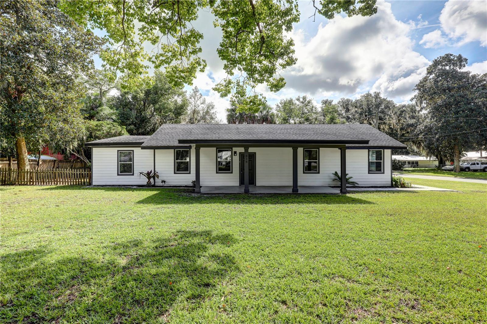 **FULL RENOVATION**CORNER LOT**NEW APPLIANCES** Welcome to this stunning, FULLY RENOVATED home! This home sits on a huge corner lot with beautiful magnolia and oak trees, creating a peaceful setting. Inside, a bright and welcoming atmosphere greets you with an OPEN LAYOUT and stylish, modern touches throughout. The spacious kitchen features a large island, WALK-IN PANTRY, soft-close cabinets, and elegant quartz countertops. Beautiful accent walls add a custom touch, while plenty of STORAGE ensures a clutter-free space. The home offers 4 beds/3 baths, including a huge master suite with a gorgeous, large walk-in shower. All bathrooms have luxurious FLOOR TO CEILING TILE. Step outside to a FENCED SIDE YARD and a pavered driveway for convenience. The true highlight of this property is the incredible 1200 SQFT WORKSHOP, offering a perfect space for a hobbyist, or a massive amount of storage. This home perfectly blends modern design with functional space, inside and out. Don't miss out!