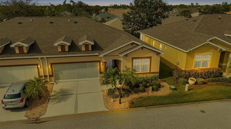 AWESOME OPEN CONCEPT in this FULLY FURNISHED/TURNKEY Legacy floor plan Villa in the gated golf course/active resort of Kings Gate, a 55+ community that is NOT in flood zone and does NOT require flood insurance. This highly desirable villa floor plan is an open concept that captures the kitchen, living room, dining room and covered lanai. Features like impact windows, solid wood cabinets, tile and luxury vinyl plank flooring (no carpet) enhance the move-in feel provided by this villa. Step inside and your eyes gaze skyward at the high ceilings and the decorative tray covered ceiling in the foyer. The massive living room combined with the lanai/dining room and kitchen give plenty of options for entertainment and/or relaxation. The guest bedroom is in the front right of the villa with the spacious master in the back left - providing TREMENDOUS PRIVACY for both you and your guests. The study/den has doors that allow you to use the space as a work from home office, 3rd bedroom, 2nd TV room - whatever fits your lifestyle. And if you haven't been to Kings Gate before - you're going to love the options for activity (Olympic size heated swimming pool and spa, tennis courts, PICKLE BALL, lawn bowling, shuffle board, bocce, horseshoes, gym, billiards, library, euchre, bingo, bridge, Texas hold em, poker, mahjong and more). The onsite Lions Den restaurant and bar is super convenient and also offers Tuesday night Karaoke and monthly trivia contests. Many residents love the fact that they are just a golf cart ride away from the shopping plaza that provides you access to grocery store, drug store, bank, restaurants and shopping. Want to explore outside of Kings Gate - your minutes away from the restaurants and shops of downtown Punta Gorda and Fisherman's village. And if you want to explore more of Florida's fun spots you’re near I75 to quickly head north or south. An AWESOME open concept villa with impact glass/new roof and more in a PREMIER gated community should be on your list. Call today for a private showing and a golf cart tour of the community/amenities.