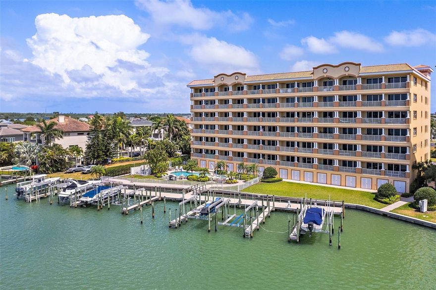DON'T LET THE OPPORTUNITY SLIP AWAY TO OWN A PIECE OF PARADISE IN THE PRESTIGIOUS GATED COMMUNITY OF REDINGTON SHORES YACHT AND TENNIS CLUB! Nestled within the exclusive La Bahia Building, this 3BR/3.5BA (plus den/study) condo is just steps away from the pristine Gulf Beaches! Built in 2007, this residence boasts over 3,000 sq ft of opulent living space featuring unparalleled water views in every direction, as the La Bahia Building offers some of the most breathtaking water vistas in the entire community. Step into a timelessly beautiful interior, revealing an open concept kitchen overlooking a dazzling living area. Panoramic floor-to-ceiling water views of the protected cove below create a captivating backdrop to your daily life. The spacious kitchen features granite counters, stainless appliances, tray ceilings, and state-of-the-art amenities, including a NEW BOSCH 800 SERIES DISHWASHER, Advantium wall oven/microwave, an additional convection oven, and sleek glass cooktop. This residence is designed for maximum versatility, offering 2 generously sized guest bedrooms, each with an en-suite full bath and walk-in closet. There’s a spacious den/study that could effortlessly transform into a 4th bedroom if desired. The luxurious primary bedroom offers private access to the huge 45 FT WATERFRONT BALCONY through hurricane impact-rated sliders. Dual walk-in closets, tray ceilings, and an expansive primary bath with dual vanities and a walk-in shower complete this waterfront retreat. Modern conveniences abound, with a BRAND-NEW WASHER/DRYER SET AND WATER HEATER in the spacious laundry room, along with both HVAC units replaced in 2015. This is a PET-FRIENDLY COMMUNITY, welcoming up to 2 pets, each weighing no more than 25 lbs. With 30-day rentals currently permitted, this unit also provides an excellent investment opportunity. The exterior of the building received a fresh coat of paint in 2023, ensuring a contemporary and well-maintained aesthetic. Enjoy resort-style amenities, including a designated heated pool & spa, community fitness center, clubhouse, tennis and pickleball courts, all within the secure confines of 24/7 gated security. Monthly dues cover water, sewer, trash, recycling, pest control, cable, and internet. Your waterfront dream home awaits – schedule a viewing today!