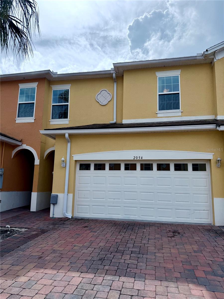 (Professional photos coming soon) Welcome to 2054 Royal Vista Court, a spacious 5 bedroom, 3 and 1/2 bath townhome offering over 2,500 square feet of comfortable living space in one of Orlando’s most convenient locations. This beautiful residence features hardwood and tile flooring throughout, a modern kitchen with granite countertops and stainless steel appliances, and a washer and dryer included for added convenience. With a 2-car garage and additional parking for up to six vehicles, you’ll have plenty of room for family and guests. The open layout provides flexible space for both relaxation and entertaining, while the five bedrooms ensure comfort for large families, groups, or those needing a home office. The primary suite offers a spacious retreat with a private bath and ample closet space. Outside, residents enjoy the peace of a quiet community while being just 2 miles from UCF and minutes from Waterford Lakes Town Center, with endless shopping, dining, and entertainment options nearby. Zoned for excellent schools this home is the perfect turnkey rental for families, professionals, or students seeking both comfort and convenience. Schedule a tour today!