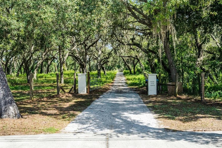 ***ADJACENT LAND TO NORTH ALSO FOR SALE (7466 Vivian Lane) MLS #O6339244.*** A generational family home sits on this expansive 36.32 acre estate. Built in 1953, this custom-built home boasts two bedrooms and two bathrooms under 3,170 square feet with an amply-sized indoor pool. Once through the gate and driving through the rolling landscape and a tunnel of mature trees you’ll approach this home resembling a Spanish villa, where the gated entry way takes you to the living room with cedar ceilings and a masonry fireplace. Older structures on the property include a fenced-in basketball court, greenhouse, playset and horse stable. And there is a matching block and stucco warehouse/workshop with two-car covered parking, rear and side garage doors, knotted oak rafters, bathroom with tub/shower combo (needs fully renovated) with electrical and plumbing to the entire structure. The primary bedroom features a walk-in closet (as does the second bedroom) where both bathrooms include a single vanity as well as tub and shower.Through the dining room you’ll find the kitchen with bar seating. Adjacent to the kitchen as a second wood-burning stone fireplace and indoor grill made for cooking together with guests.When not entertaining, step into the indoor pool engulfed by an abundance of natural light through the many windows and sliding glass doors. The ceiling boasts tongue and groove cedar planks and beams.There are two dressing rooms and yet another stone-built fireplace that heats the pool with pipes built into the pool’s foundation. As you could imagine, there was a time where the family enjoyed not only this home, but the potential in this unique northwest Orlando property lies in the vast mostly cleared pastures and fields. It was a working farm back in the day with horses and cattle and currently zoned A-1 Agricultural. Swimming in the spring-fed pond was a regular activity on hot summer days. While the home has not only a lot of history and good bones, it could use some TLC and remodeling, the potential in this property lies with the land. Build your custom-built dream home or re-establish the homestead as a farm, nursery or equestrian center. Farm animals are permitted subject to county guidelines. Custom built homes, accessory dwelling units and setbacks subject to building codes.The potential is huge for rezoning as well as for city or county government development opportunities like a community complex. Ideal for mixed-used, retail, institutional and nonprofit projects and the possibility for residential development and various real estate ventures. Easy access to major highways, infrastructure and local amenities. Everything needed to live, shop and play is minutes away. Country-living in a great location with privacy and access to all central Florida has to offer. 20 minutes to schools, hospitals, the YMCA as well as parks, golf and other outdoor activities. DOWNTOWN ORLANDO and its amenities including professional sports, festivals and concerts among other events are a short drive. Orlando International Airport, Universal Studios, SeaWorld and Disney World are a 30-minute drive. It’s just 60 minutes to the East Coast and in just two hours you can be on the beautiful beaches of the Gulf of America!! Prime location and great investment to buy and hold or build and develop with solid growth potential. You don’t want to miss this rare opportunity to make this substantial plot of central Florida real estate your own!!