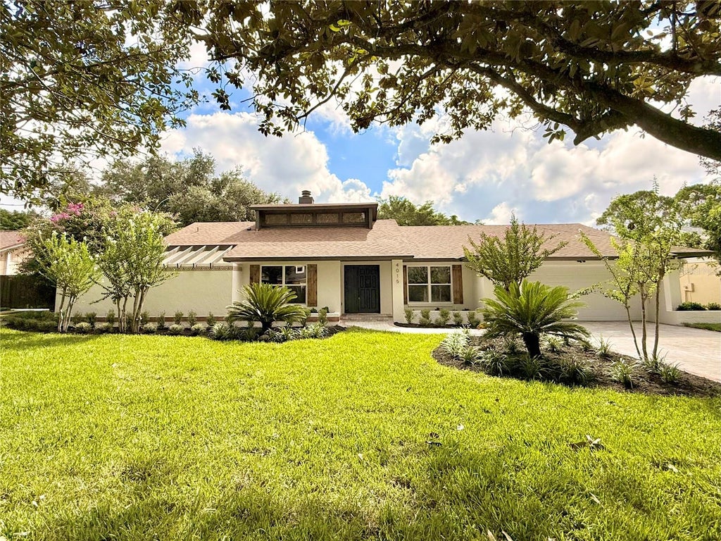 Photo of 4015 Lake Mira Drive, Orlando, FL 32817 (MLS # O6437719)