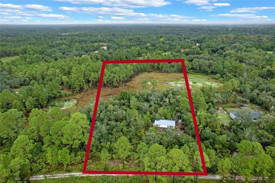 This 5-acre property is an exceptional opportunity, offering a tranquil retreat near the natural beauty of Lower Wekiva River Preserve State Park. With approximately 3 acres of buildable land in desirable Flood Zone X, and 2 acres of wetlands adding privacy and a picturesque setting, the possibilities are extensive.  The land has been partially cleared, and while there is an old mobile home and three vehicles currently on-site that will need removal, the property boasts several key improvements, including a septic system, a well, and electrical service. Spectrum has recently extended service to the area, ensuring modern connectivity. Impact fees have been partially covered, simplifying the path to building your dream home or placing a new mobile home. Zoned for agriculture, this lot also welcomes your horses or livestock.  For inspiration, the adjacent 5-acre property has already been cleared and developed, showcasing the potential of this land. Access is via Blackwater Oaks, a peaceful, dirt road maintained voluntarily by the neighbors. Whether you're seeking a rural homestead, a private retreat, or space for a small farm, this property is a fantastic canvas for your vision.   This area is on the rise, offering incredible value with growth potential! Don't miss the chance to secure your piece of paradise before prices increase. With nearby developments and improvements already happening, now is the perfect time to get in at ground level and create your ideal rural haven or investment property.