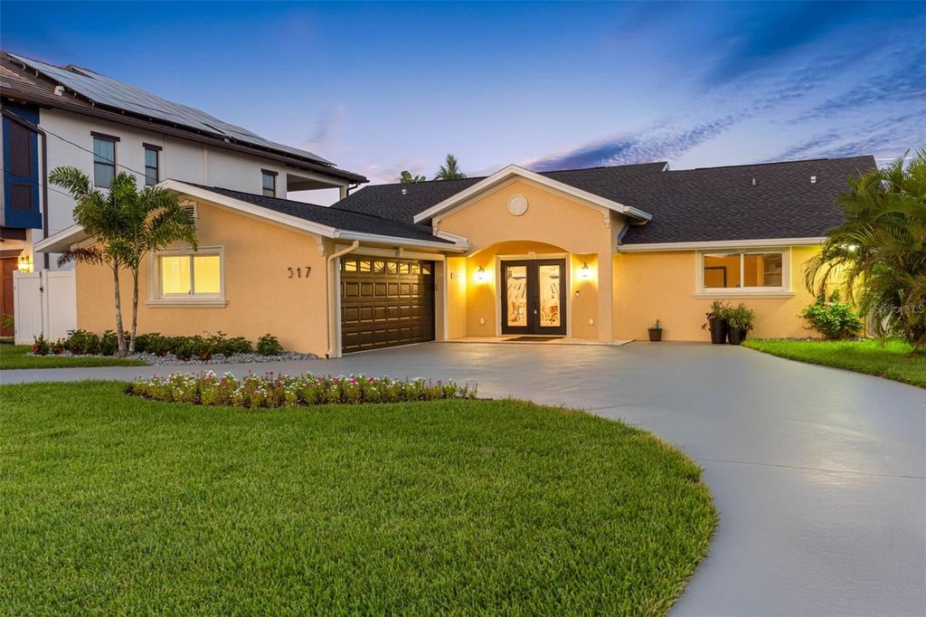 Photo of 517 Johns Pass Avenue, Madeira Beach, FL 33708 (MLS # TB8411689)