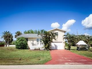 Welcome to your slice of coastal paradise! This charming 3-bedroom 2-bathroom Florida style home sits proudly on a corner lot with stunning views and direct Gulf access via a community private boat ramp. Featuring a durable metal roof, updated kitchen, and a bright Florida room. This Home blends modern updates with classic Florida charm. Enjoy the convince of an open floor plan, spacious bedrooms and plenty of natural light throughout. The outdoor space offers lush landscaping and space to add a pool or deck. Located close to shopping dining and beaches, this is a waterfront lifestyle you've been waiting for!