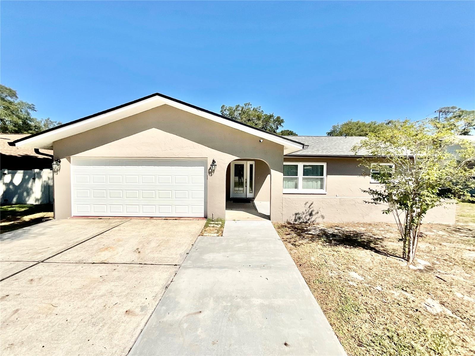 BEAUTIFUL REMODELED PALM HARBOR HOME - WALK TO TOP RATED PALM HARBOR SCHOOLS AND COMMUNITY POOL CENTERS. GORGEOUS UPDATED KITCHEN AND BATHS , ALL TILE FLOORING , LARGE 26FT LONG GARAGE, WHOLE HOUSE SOPHISTICATED WATER FILTRATION, INSTANT TANKLESS HOT WATER , PVC FENCED BACK YARD. INSANELY LARGE REAR PORCH WITH HIGH CEILINGS IS 24x31 Ft. EXCELLENT LOCATION JUST 5 MINUTES TO THE GULF BEACHES. PETS OK W FEE. AVAILABLE FOR MOVE IN NOVEMBER 1