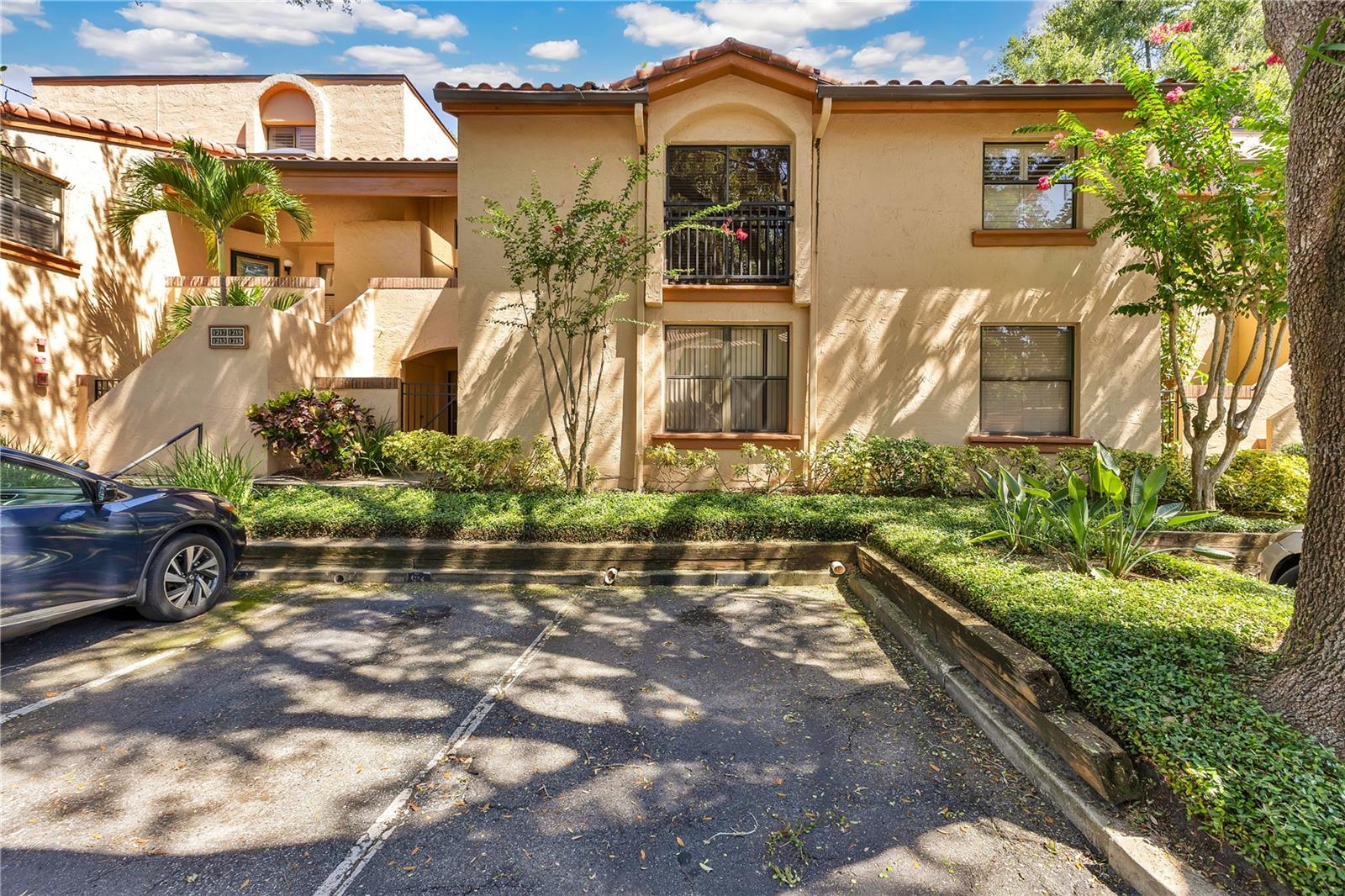 Tucked behind the gates of Lake Pineloch Village, this first-floor 2-bedroom, 2-bath condo offers easy, everyday living in one of Orlando’s most charming lakefront communities. Surrounded by lush landscaping, mature oaks, and the tranquil waters of Lake Pineloch and Lake Willisara, this Mediterranean-style, guard-gated enclave feels worlds away — yet it’s just minutes from the downtown Orlando. Step inside to a bright, well-designed layout with a spacious great room that opens directly to your own private, screened-in lanai — the perfect spot to relax or entertain. The split bedroom layout offers privacy and flexibility, with a generous primary suite featuring an ensuite bath and walk in closet on one side, and a guest bedroom and full guest bath sit on the other. Additional perks include a laundry room, ample storage, and an outdoor storage closet just off the front patio. Life in Lake Pineloch Village is about more than just a home — it’s about the lifestyle. Spend your weekends with choices— pick a pool: one lakeside, one secluded, or launch a paddleboard or kayak from the private dock, fire up the grill after a friendly tennis match, or mingle with neighbors at the poolside tiki hut. Residents also enjoy access to boat slips, a car wash area, tennis courts, and low-maintenance living with exterior upkeep, cable, and trash all covered. Conveniently located just minutes from Orlando Health, Downtown Orlando, and zoned for top-rated Blankner K-8 and Boone High School, this is the kind of place people rarely leave — and for good reason. Come experience life by the lake and see what makes Lake Pineloch Village so special.
