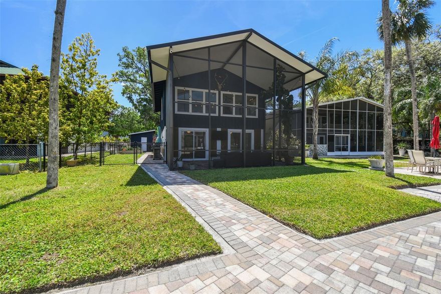 Welcome to your DREAM RIVERFRONT RETREAT on the iconic WEEKI WACHEE RIVER! This beautifully updated 3 BEDROOM, 2 BATHROOM home delivers the perfect balance of luxury, comfort, and effortless coastal living. Step inside to discover premium LVP and tile flooring throughout, along with a bright open layout designed to capture the peaceful beauty of the river. The CHEF'S KITCHEN is a true standout, featuring solid wood cabinetry, quartz countertops, a stainless-steel appliance suite, and a hidden walk-in pantry with exceptional storage. Thoughtful CUSTOM BUILT-INS elevate the living space, including a beautifully designed entertainment wall, charming dining nook, and a functional built-in office area. The upper level is framed by a dramatic WALL OF WINDOWS that floods the home with natural light and showcases BREATHTAKING WATER VIEWS. Just off the kitchen, the PRIVATE PRIMARY SUITE offers a walk-in closet and a serene retreat: SPA-LIKE EN SUITE BATHROOM complete with a freestanding soaking tub, walk-in shower, and private water closet. Outdoor living is equally impressive with a spacious TWO-STORY SCREENED ENCLOSURE, a stunning PAVER PATIO ALONG THE WATER, and prime river frontage with your own dock and boat slip access — ideal for boating, kayaking, paddleboarding, and watching the manatees drift by. Additional highlights include HURRICANE-IMPACT WINDOWS AND SLIDERS, a fenced side yard, storage shed, and ample parking for cars, golf carts, and boat trailers. Situated in an AIRBNB-FRIENDLY COMMUNITY and offered FULLY FURNISHED AND STOCKED, this property is completely turnkey and ready to enjoy as a primary residence, vacation getaway, or lucrative short-term rental. Just a short boat ride to the OPEN GULF, or minutes away from Rogers Park and the head of the natural spring. Experience the magic of Weeki Wachee riverfront living — where every day feels like a waterfront escape!