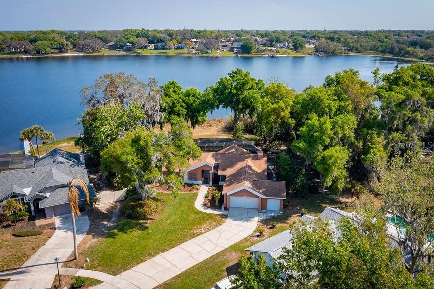 Welcome to your private lakefront retreat on beautiful Lake Rose! Nestled at the end of a quiet cul-de-sac, this stunning 3-bedroom, 2-bathroom home offers jut under 2000 square feet of thoughtfully designed living space, perfect for both relaxation and entertaining. The home features a spacious layout with comfortable living areas. A 3-car garage provides ample space for vehicles, storage, and all your lake toys. Step outside and experience the ultimate waterfront lifestyle with your own private concrete boat ramp, making launching effortless, along with two private docks, perfect for relaxing, entertaining, or securing multiple watercraft.  Boasting an impressive 159 feet of pristine lake frontage, this property delivers breathtaking water views and unmatched access to outdoor recreation. Whether you enjoy fishing at sunrise, boating across open water, or spending the day waterskiing, paddle boarding, or kayaking, this lake is a true playground right in your backyard. Additional peace of mind comes with a roof that was replaced just 4 years ago, offering durability and long-term value. This rare lakefront gem combines privacy, functionality, and year-round recreation, all in a highly desirable cul-de-sac location in Lake Rose Pointe. Whether you're looking for a full-time residence or a weekend escape, this property is ready to deliver the lifestyle you've been dreaming of.