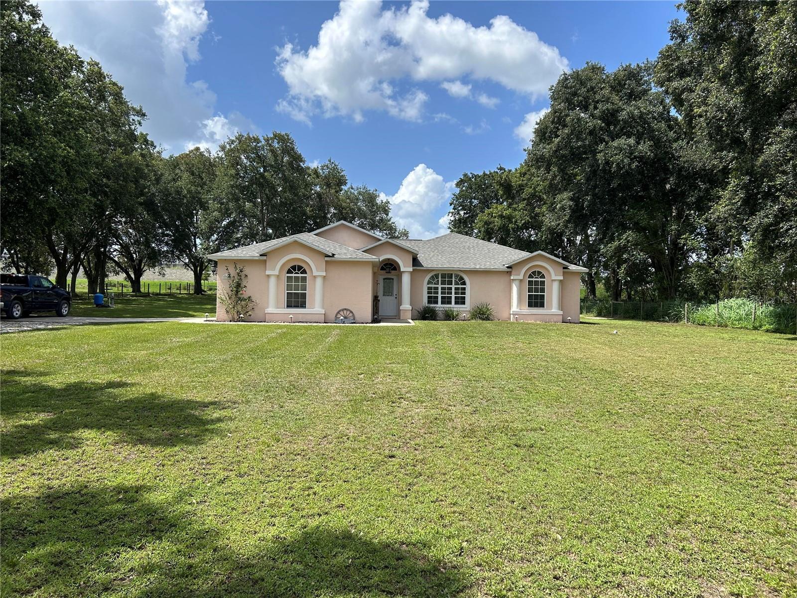 CLEAN, TIDY, MOVE-IN ready. Great location for easy commute to Lakeland and Tampa with Wesley Chapel entertaining and shopping malls 25 minutes away. Located atop a hill in North Zephyrhills only minutes from shopping, schools, churches, and medical facilities. This 3 bedroom, 2 bath, split floor plan is designed around a large Great Room perfect for family living. The added BONUS ROOM makes it the perfect location for a growing family! This efficient kitchen has 2 pantries, a breakfast bar open to the dining area, and great views of the fully fenced in oversized backyard. This home has been kept in tiptop shape with Central HVAC as well as the ROOF replaced in 2023. The home is situated on a full 1 acre providing great privacy while still being in close proximity to everything! This fully fenced in lot makes it perfect for outside gatherings! Enjoy your time around the backyard fire pit, swim in the refreshing above ground pool, and soak in the views!