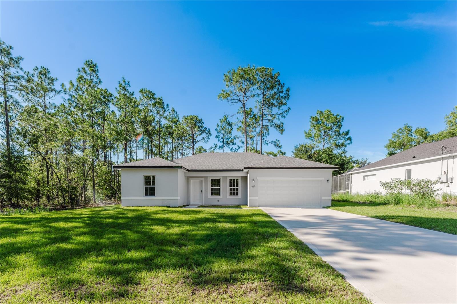 Welcome to your brand-new, move-in-ready home in the heart of Citrus Springs! This beautifully built 4-bedroom, 2-bath residence offers a modern open floor plan designed for both comfort and style. From the moment you walk in, you’ll notice the spacious living areas and seamless flow, perfect for entertaining or relaxing with family. The gourmet kitchen overlooks the main living space and features quality finishes and ample storage. No carpet anywhere—this home boasts elegant porcelain tile throughout, combining durability with contemporary style. The split-bedroom layout provides privacy for the primary suite, which includes a walk-in closet and a beautifully appointed en-suite bathroom. With energy-efficient construction and thoughtful design, this home offers low maintenance and peace of mind. Located on a quiet street in the growing Citrus Springs community, you’ll enjoy easy access to nearby parks, golf, and the natural beauty of the Nature Coast. Don’t miss your chance to own this turnkey home in one of Citrus County’s most desirable up-and-coming areas!