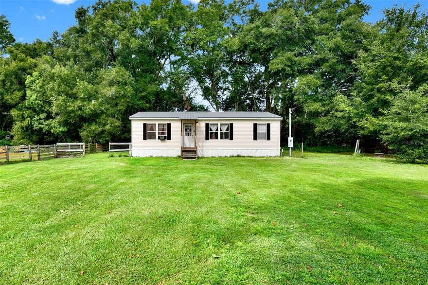 Conveniently located just off of Highway 484 between US HWY 301 and I-75, you will find this 3BR/2BA gem ready to call "Home".  Built in 2008, no HOA. this double wide manufactured home has been updated with a newer metal roof and covered entry, new laminated floors and new central AC, heap pump Unit.  With +/- .36 Acres of luscious greens, wooded area behind, and a beautiful sycamore tree in the front lawn, you will have plenty of room to unwind in the natural surroundings.  Not only does it great curb appeal, but it features over 1,000 sqft of living space, a split floor plan with spacious living room, dinette, and interior washer/dryer hookups.  Don't let this home slip by! Contact us today for your private showing. Price to sell fast.