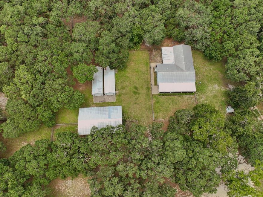 10-Acre Private Country Estate with Two Homes – $599,999
Marion County, FL | High & Dry | FHA • VA • USDA Eligible | Completely Turnkey
Rarely does a property this peaceful, private, and versatile come on the market at this price.
10 gorgeous, fully-fenced acres of rolling pasture and mature oaks create your own personal retreat just minutes from everything Ocala has. High and dry (no flood zone), with plenty of room for gardens, animals, toys, a pool, or simply enjoying the quiet.
Main Home – Built 2004
3 bedrooms + huge 25 × 22 great room
Massive 46 × 12 screened front porch with ramp
Covered 27 × 14 back deck with ramp — perfect for morning coffee or evening cookouts while watching the sunset over your land
Separate Guest House / Mother-in-Law Suite
Full second home with 3 bedrooms, its own garage, and private driveway
Perfect for multi-generational living, long-term guests, home office, or immediate rental income
Extra Features You’ll Love
Two large pole barns / workshops
Additional storage sheds
Covered RV parking with hookups
Room for chickens, goats, 4-H projects, or just wide-open play space.
All of this for only $599,999 — two move-in-ready homes on 10 beautiful acres, no flood zone, and eligible for FHA, VA, and USDA financing.
Properties that have this much land, privacy, and flexibility under $600k disappear fast. Bring the family, bring the toys, bring the dreams — this one is ready for you today.
Schedule your private showing now. Once you stand on that back porch and look out over your own 10 acres, you’ll never want to leave.
Contact us today — this special place won’t last long! ????