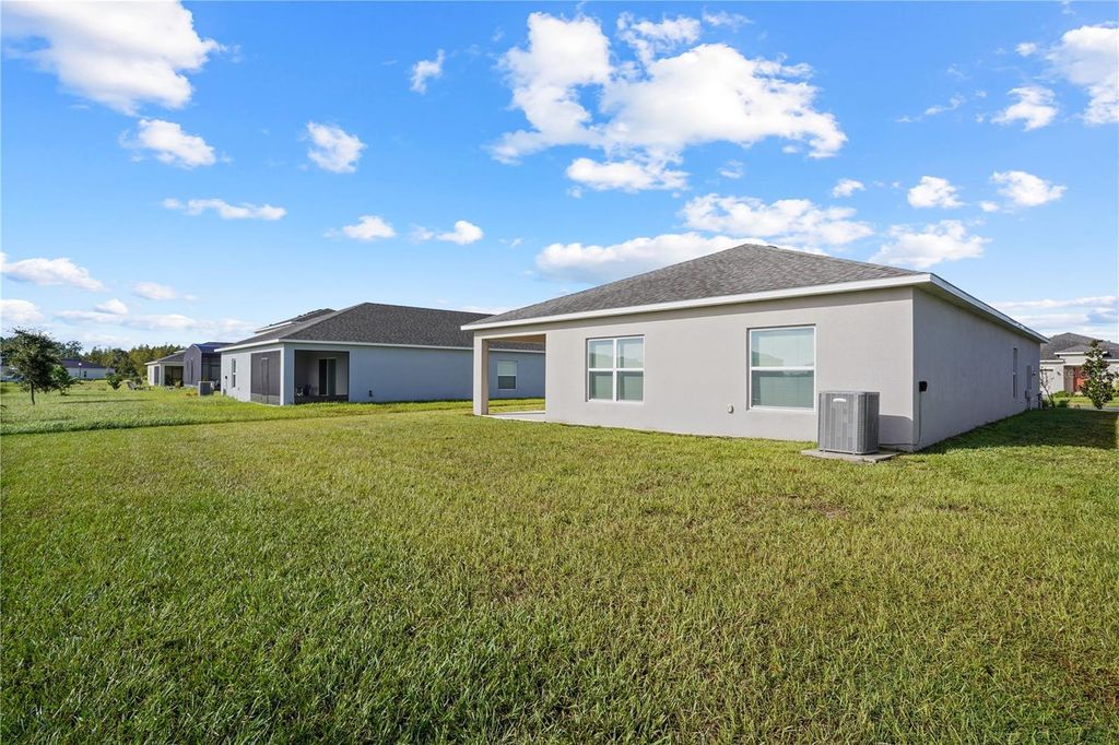 Photo of 221 Aquamarine Lane, Kissimmee, FL 34758 (MLS # O6349679)