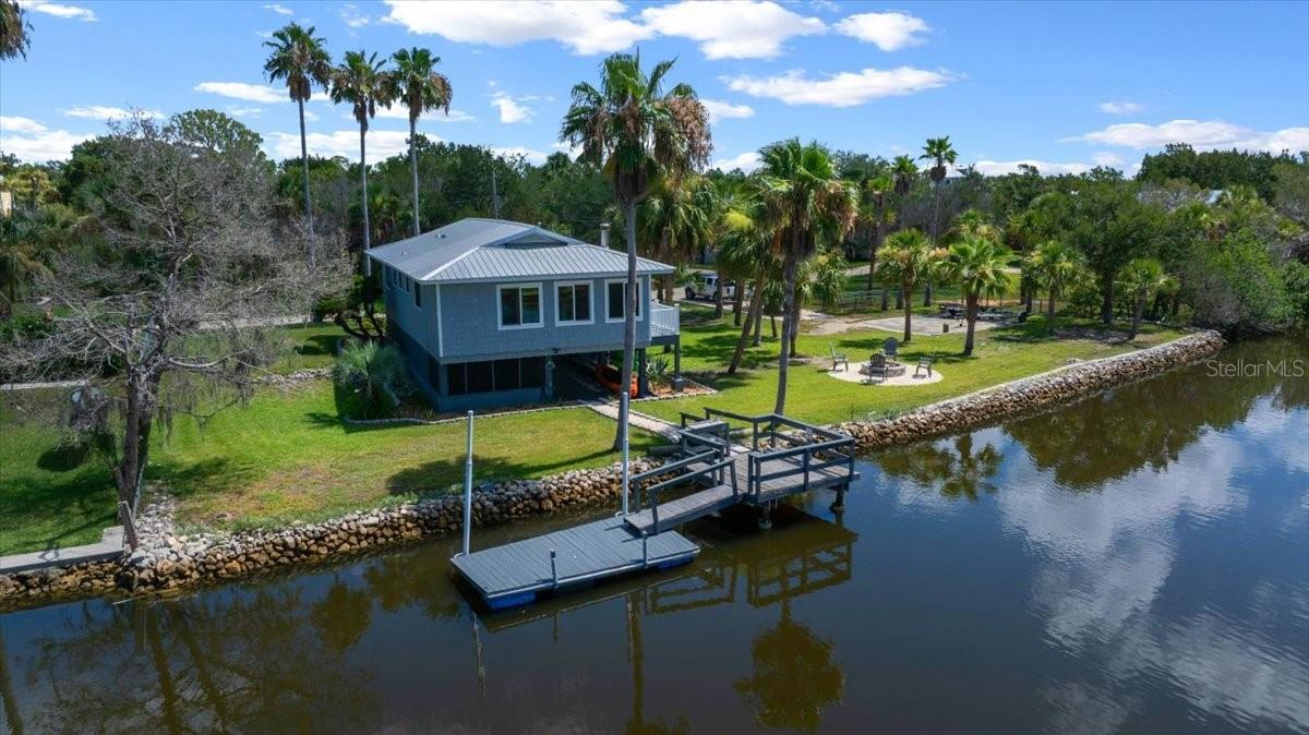 Move-in Ready, Waterfront Stilt Home in Crystal River – Double Lot, Dock, RV Pad & More! Welcome to your very own waterfront retreat in beautiful Crystal River! This fully furnished 2-bedroom, 1-bath stilt home is perfectly positioned on a fenced double lot with stunning water views from almost every room. Whether you're looking for a peaceful second home, a retirement escape without an HOA, or a full-time residence with room to grow, this property checks every box. Step inside to enjoy a large, open floorplan with beautiful panoramic water views, along with the multiple seating areas, which makes this home suited for entertaining. The home is fully updated—no renovations needed—making it completely move-in ready so you can immediately enjoy the laid-back Florida lifestyle. The numerous tasteful finishes include, charming pine ceilings, hardwood bamboo floors, large kitchen island with storage, a walk-in pantry, butcher block countertops, and custom walk-in shower, to name a few. The durable metal roof adds long-term peace of mind. This property is the ideal worry-free getaway. With 163' +/- of water frontage, extra wide canal, stationary and a floating dock, and dedicated neighborhood boat ramp, you can enjoy direct access to the Gulf with no bridges. The fenced-in yard features a dedicated boat/RV pad with power — excellent for outdoor enthusiasts and visiting guests, and a large firepit. Under the house features a screened-in dining room, 2 secured storage areas, kayak rack, and large open air area for all your gear. The large double lot has the potential for possible home addition(s), a pool and/or garage. Check with Citrus County for all the options. This peaceful neighborhood is surrounded by frequent wildlife visitors both swimming and flying by. Enjoy a fresh fish and/or blue crab dinner caught right from your dock! World-class fishing is just around the corner—redfish, trout, cobia, snook, tarpon, flounder, sheepshead and more. This home offers a lifestyle you won’t want to leave! Just a short drive to Fort Island Beach, Three Sisters Springs, and historic downtown Citrus Avenue, along with all the restaurants, shops, and recreation Crystal River/Citrus County has provides—this is Florida living at its finest. All furnishings included, but negotiable.
